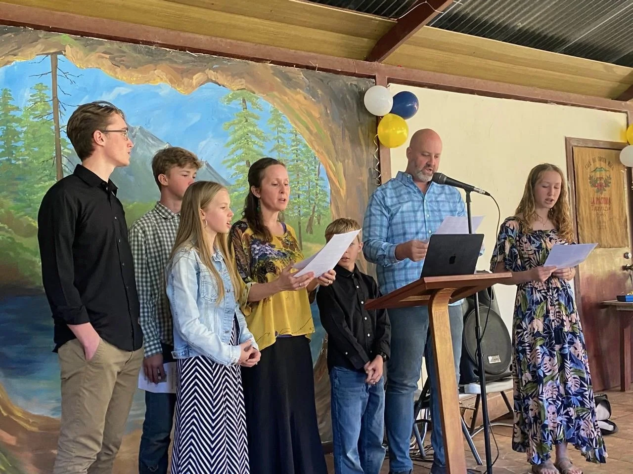 Helmuth family singing 606 as the invocation at Aspen's graduation