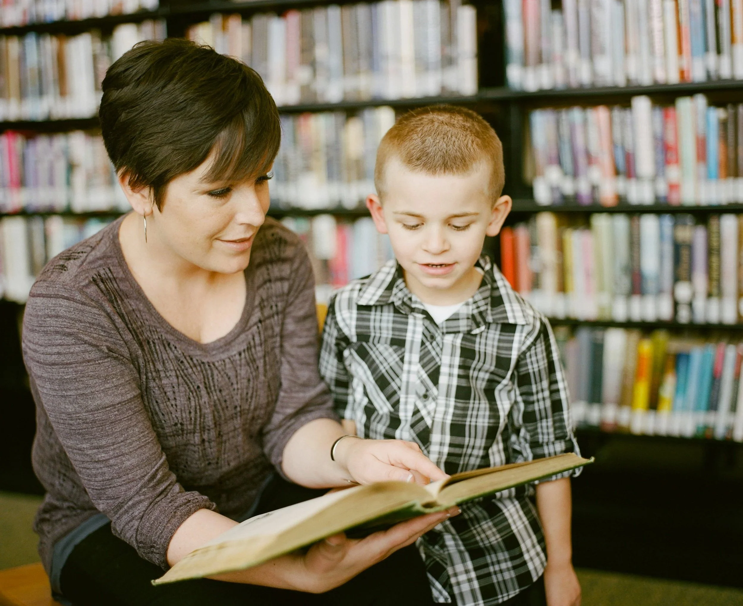 A Maryland educator offering supportive, one-on-one guidance to a student, representing the dedicated work teachers do every day.