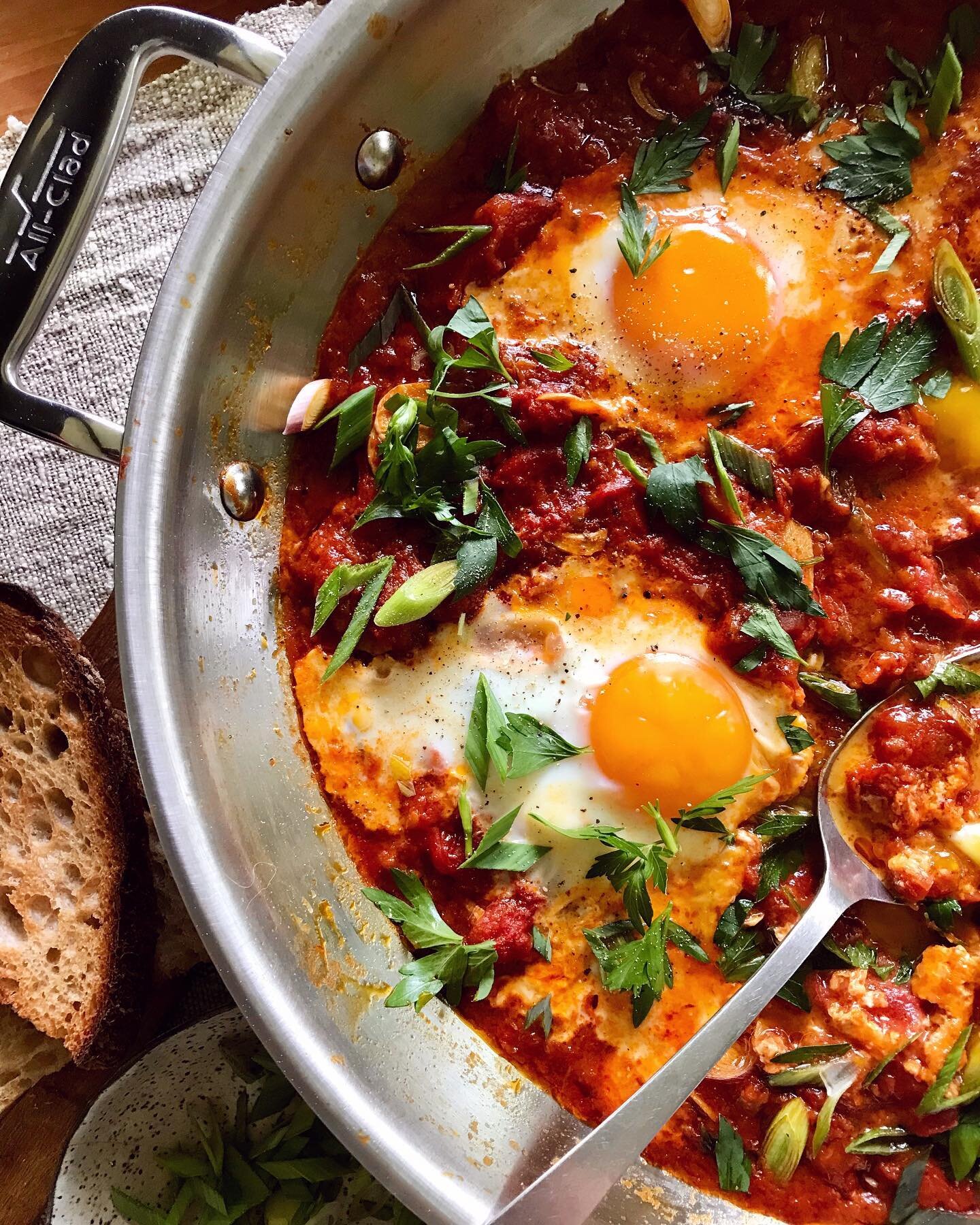 #Ad I make jammy shakshuka for @catbirdcottage guests, family, and anytime I want a special-feeling meal. This version is one of my favorites, with green garlic &amp; herbs from the garden. I especially love using the All-Clad D3 Stainless universal 