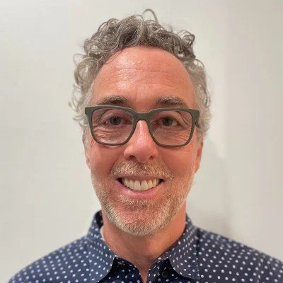 chris schifando in blue polka dot shirt