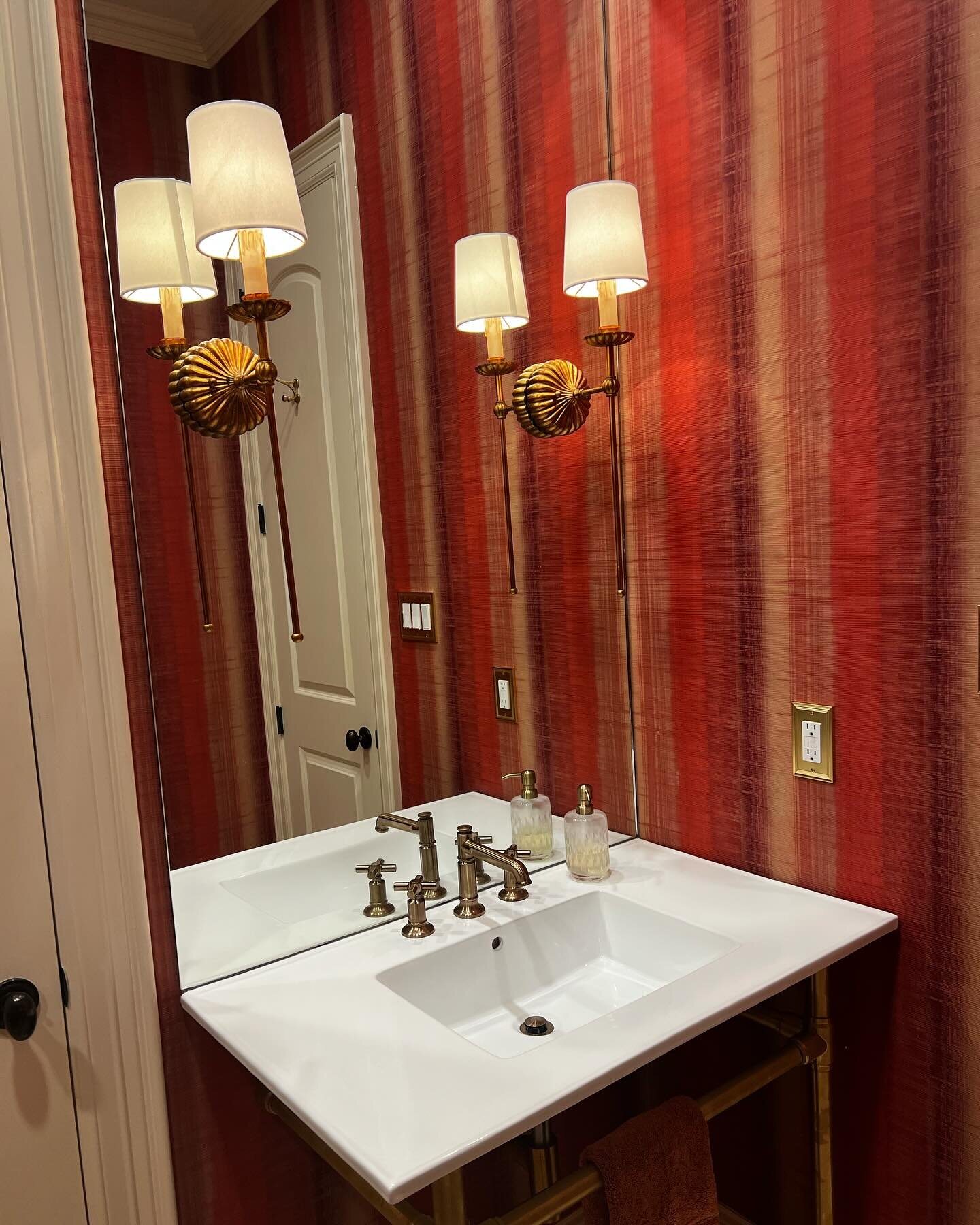 Transformed this bathroom into a luxury guest retreat 🔥 From the bold red wallpaper to the vintage brass fixtures, our walk-in shower and new sink make this space a showstopper.

➔ ➔ Swipe to see the before!