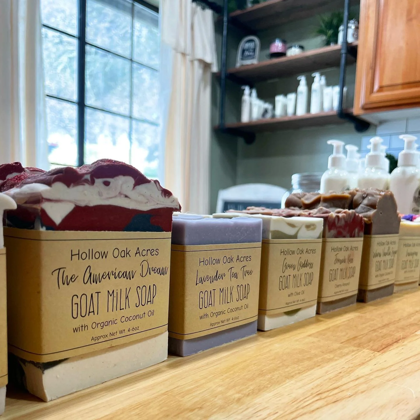 Handmade goat milk soap bars in the workshop including Lavender Tea Tree and American Dream scents.