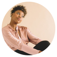 Image of a woman wearing a peach colored silk top - Noelle Skaggs Testimonial - fitz and the tantrums