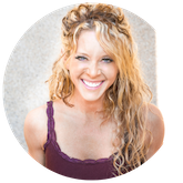 Image of woman with long curly blonde hair smiling