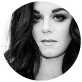 Black and white image of beautiful woman with dark hair and eyes