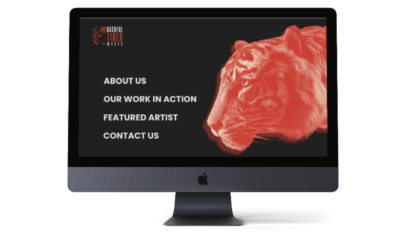 A person working on a digital editing station with dual monitors displaying video editing software and an astronaut in digital scenes.