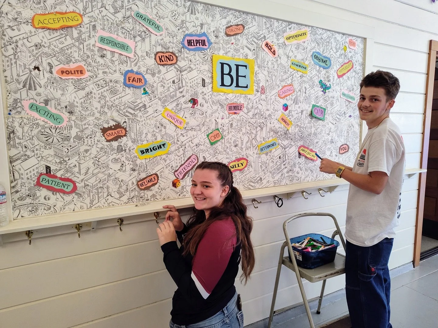 Aurora and Legend working on the new bulletin board... it&rsquo;s their first day of Community Service at CCM💜