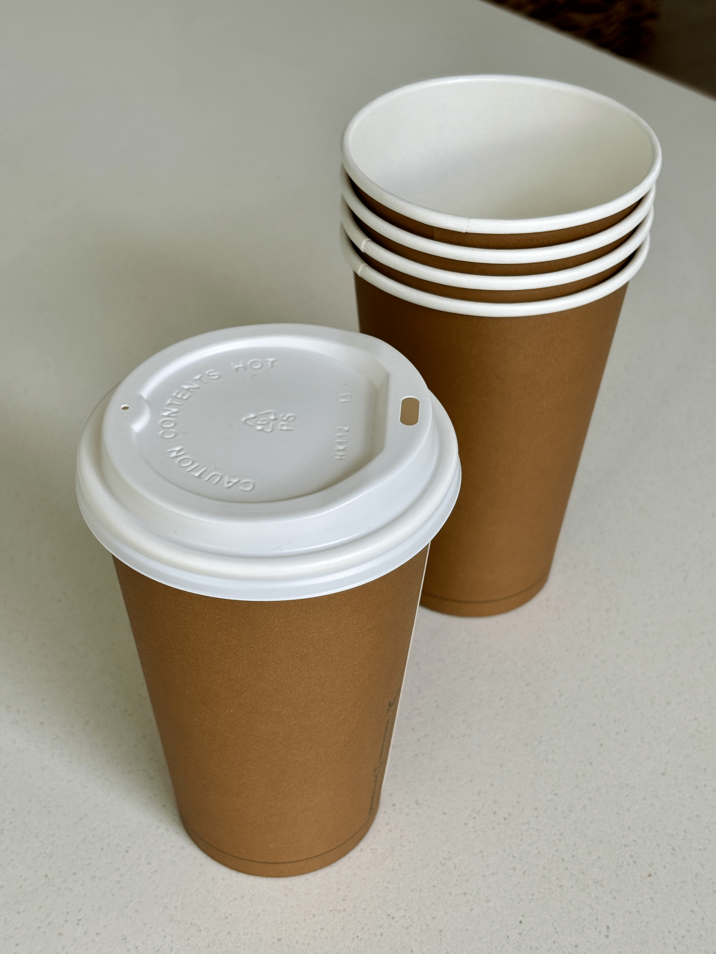 brown-coffee-cups-with-white-lid.png