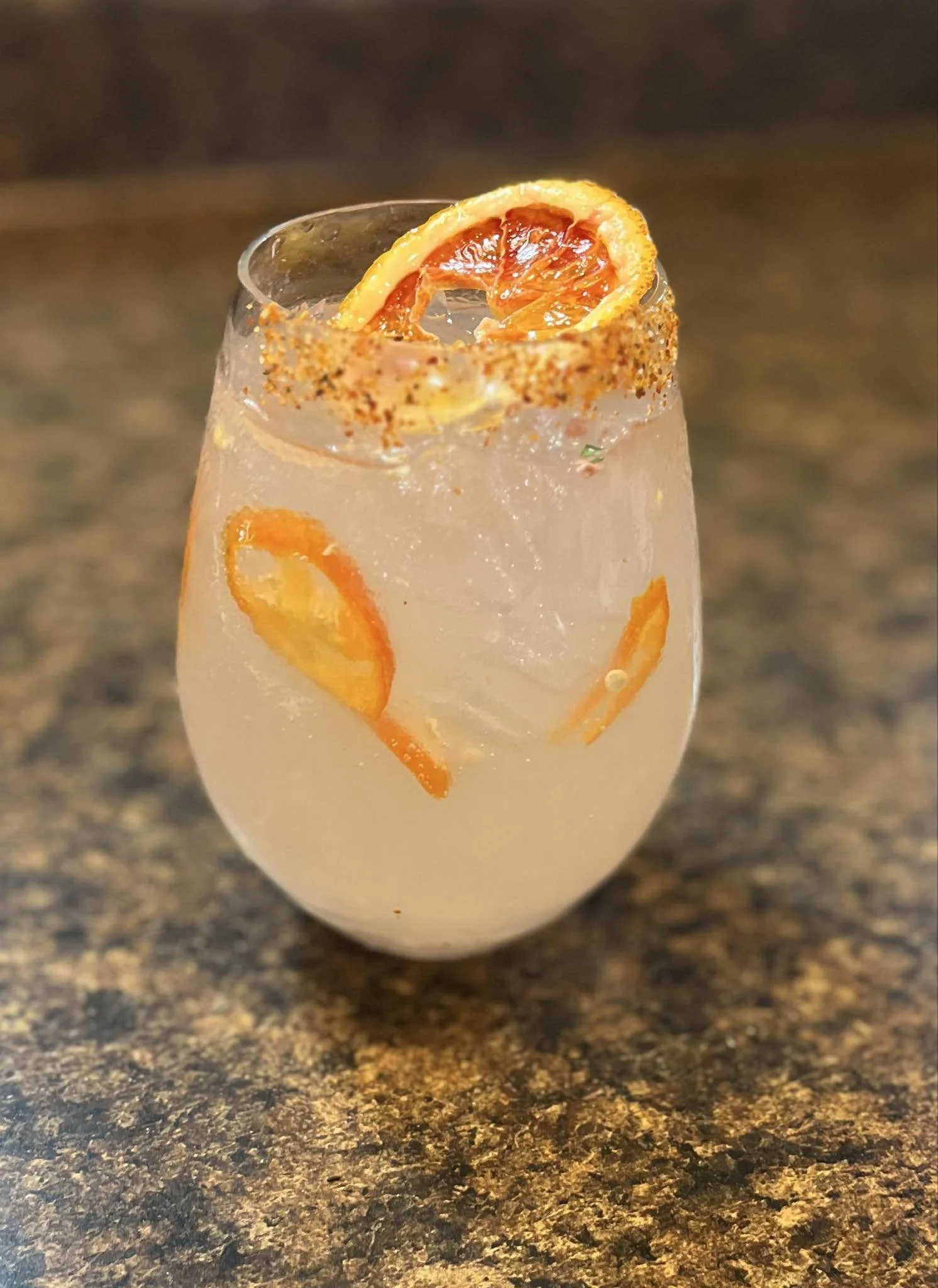 This recipe gives the classic Paloma a kick with Korean orange chili along with the tequila, lime, grapefruit soda, and a tajin rim. As seen on Grubmatch.
