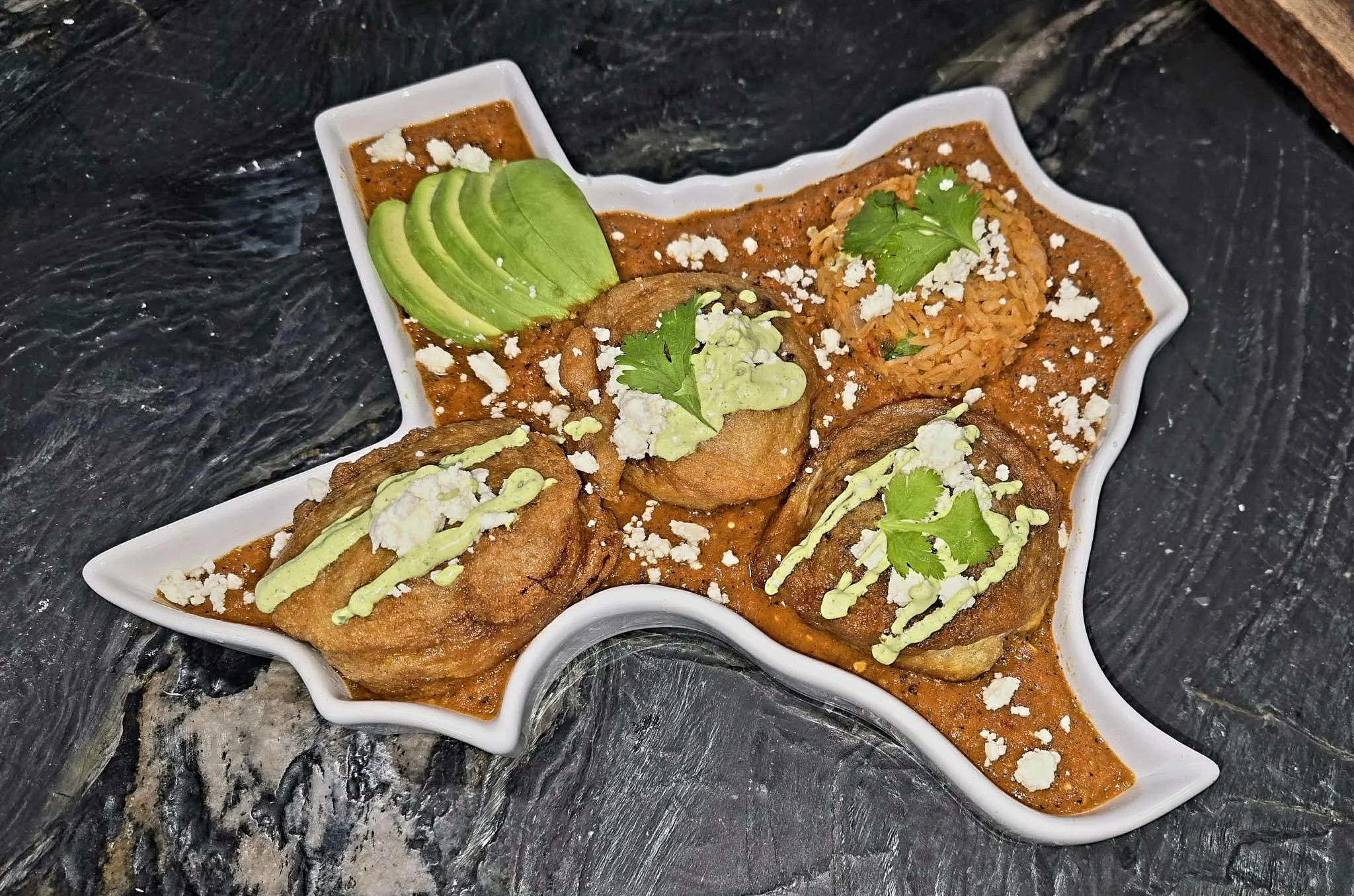 Texas Relleno Cheese Bombs with Roasted Salsa Gravy and Cilantro Garlic Lime Crema