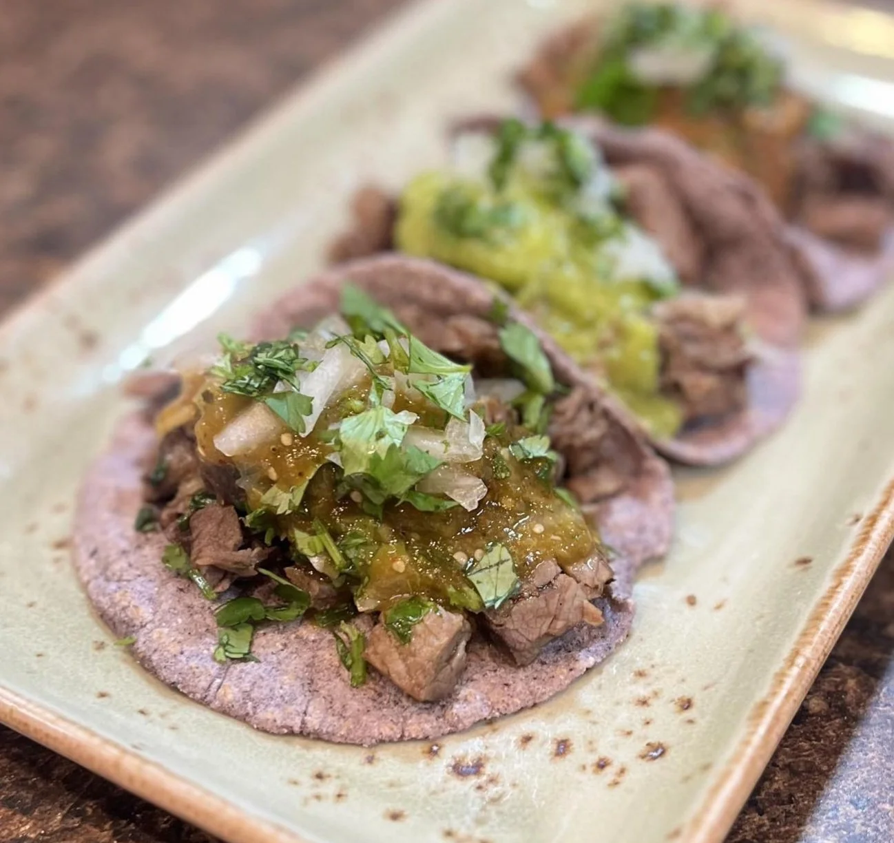 Make blue corn tortillas from scratch with P.A.N cornmeal, blue corn maseca, hot water, and salt. Serve with your favorite taco fillings