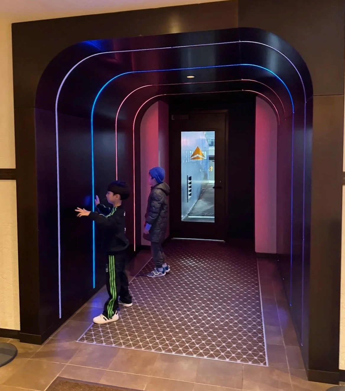 Light-lined VIP tunnel leading from the Delta Sky360 Club to the field at Citi Field