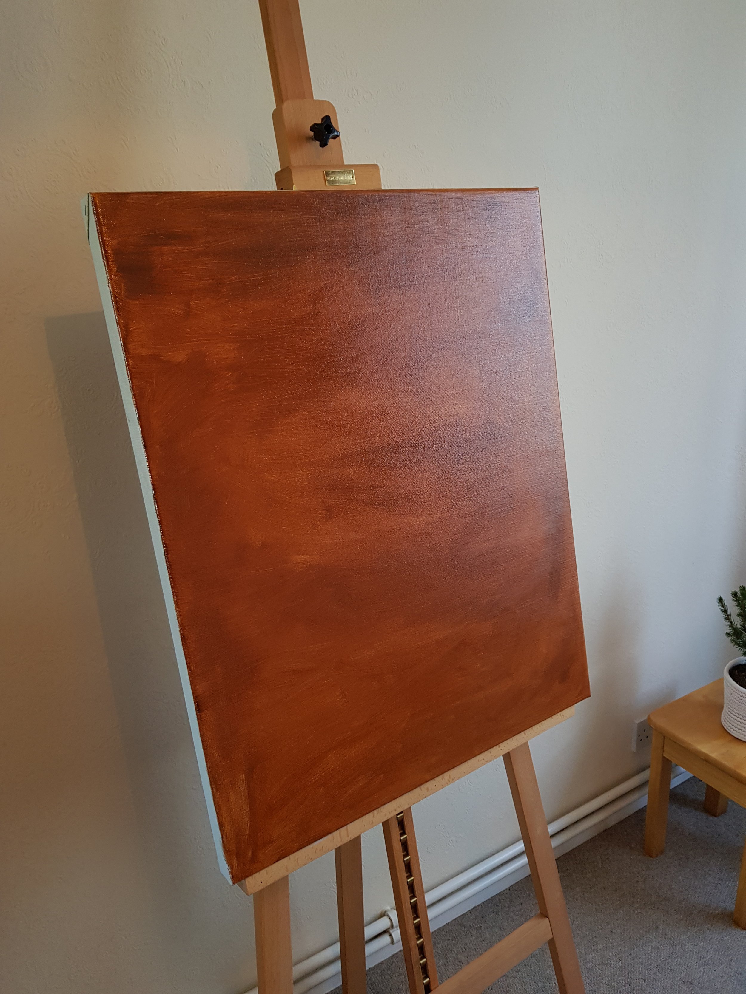 Using a combination of red bole, burnt umber, and ivory black to achieve the correct tonal quality