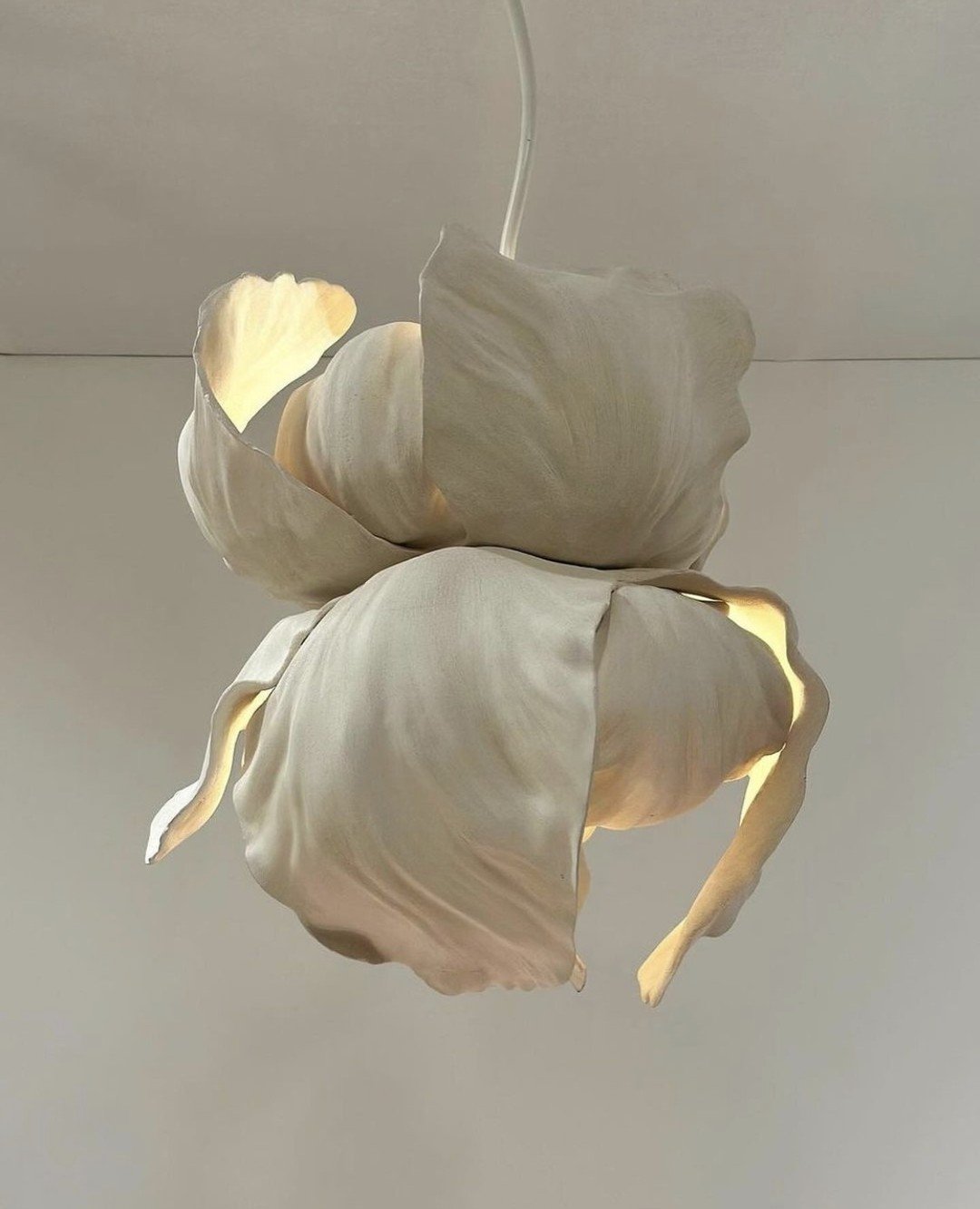 Embracing the artistry of illumination! ✨⁠
⁠
J'adore this stunning Guernica pendant light by Lighting Designer @mathieulehanneur &ndash; a radiant bloom inspired by the delicate iris flower, handcrafted from elegant ceramic. ⁠
⁠
We're captivated by t