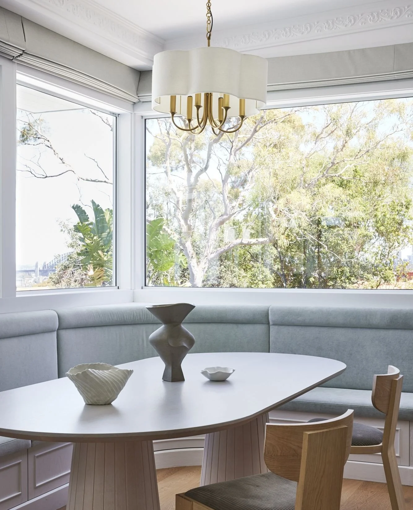 This dining nook at Home Thompson balances comfort with elegance. Banquette seating upholstered in soft tones, a sculptural table base, and views that connect the indoors to the natural landscape beyond.⁠
⁠
Every element has a purpose: to create a sp