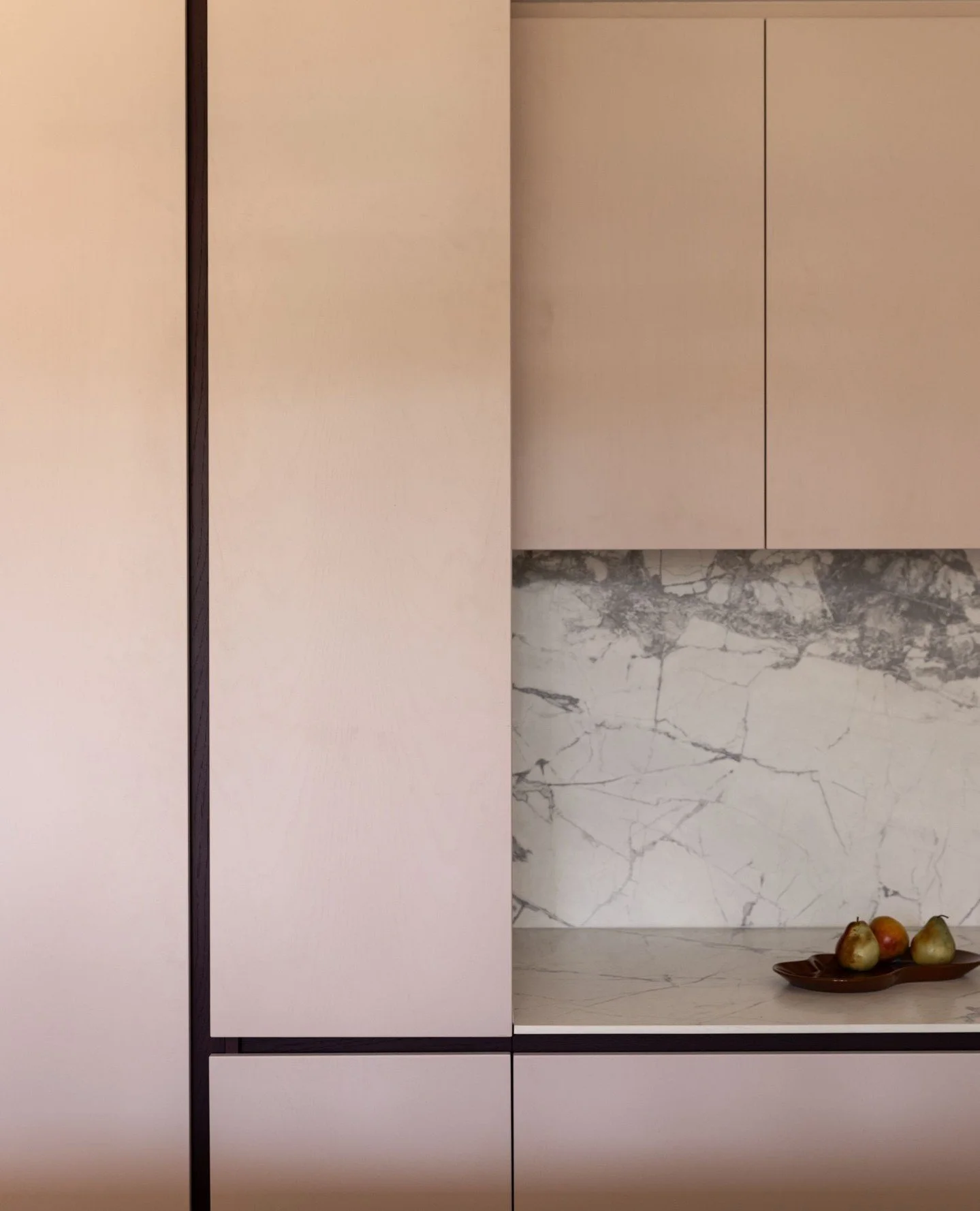 For the joinery at Home Forbes, we leaned into a refined blush palette offset by strong, linear framing. The hero is the stone splashback, a beautifully expressive marble that brings depth and natural variation to the kitchen. ⁠
⁠
The balance between