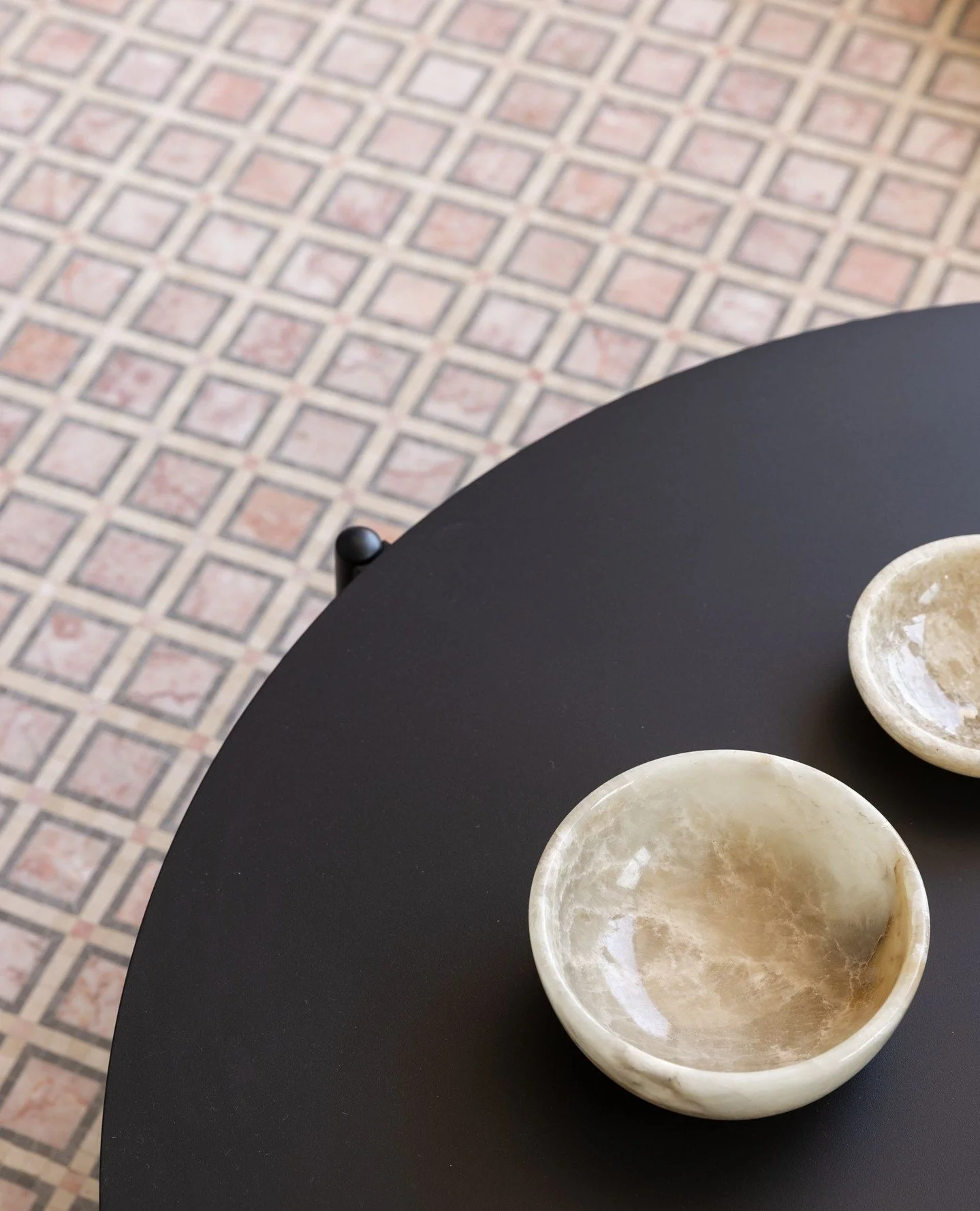 Outdoor spaces deserve the same level of detail as the interiors.⁠
On the balcony at Home Forbes, we layered a sleek black fa&ccedil;ade with a soft outdoor lounge and a geometric mosaic tile that adds pattern and interest underfoot. The result is a 