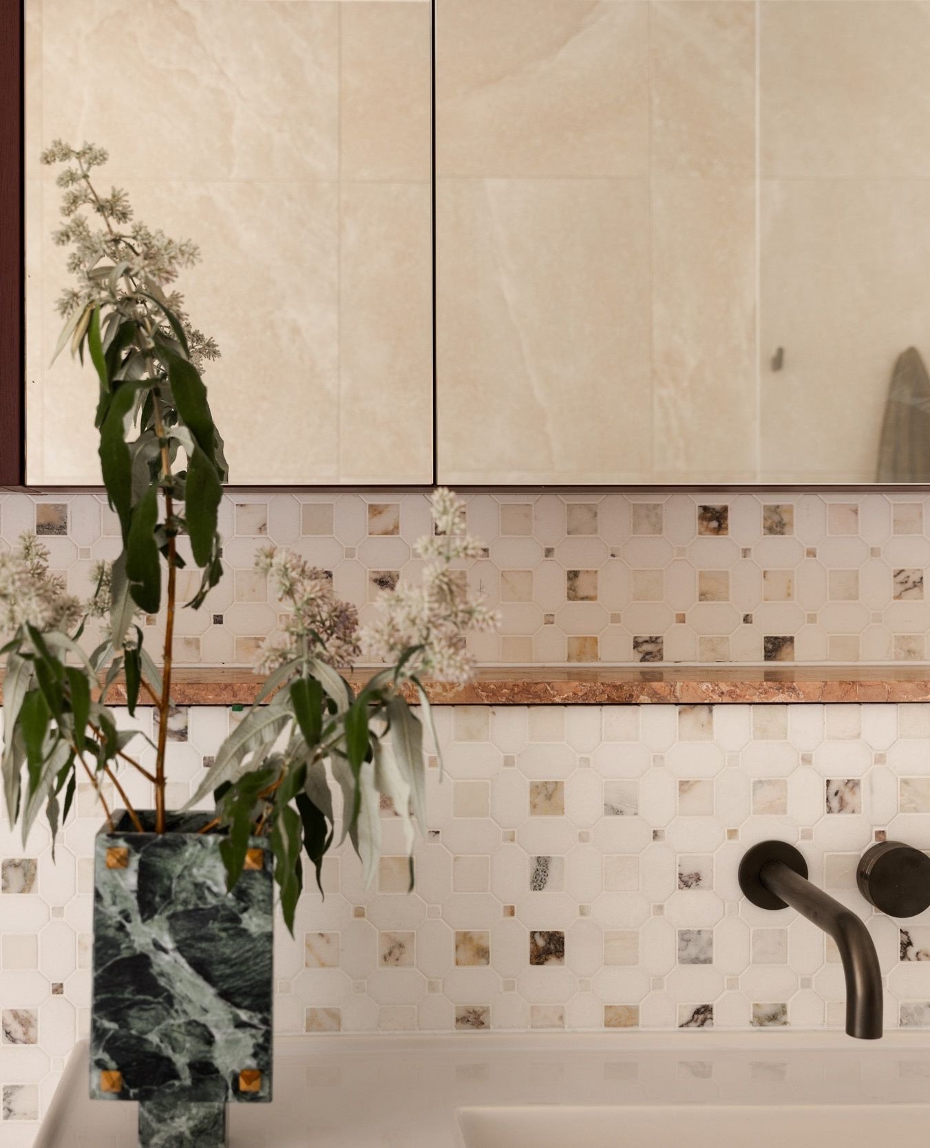 This bathroom palette layers tonal stone mosaics, warm metals and sculptural accessories to create a calming, tactile retreat.⁠
⁠
A gentle reminder that thoughtful material pairings can completely transform a space.⁠
⁠
Interior Design @catherinedemeu