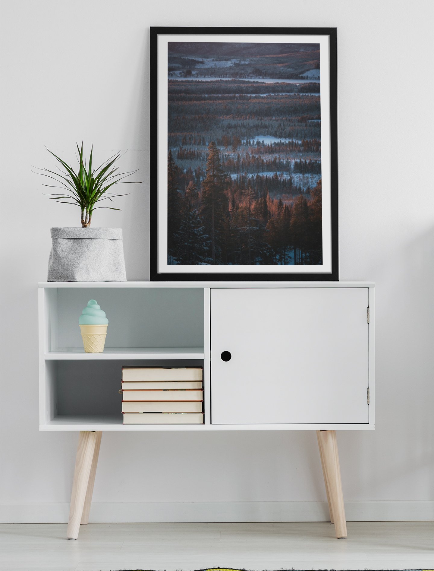 mockup-of-an-art-print-placed-on-a-minimalist-furniture-with-a-plant-38693-r-el2.jpg
