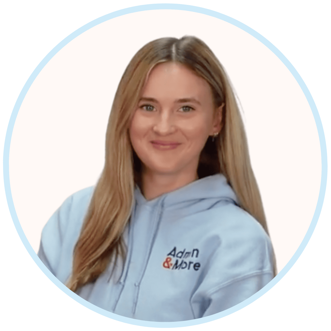 A smiling woman with long blonde hair wearing a light blue hoodie with 'Adam & More' logo.