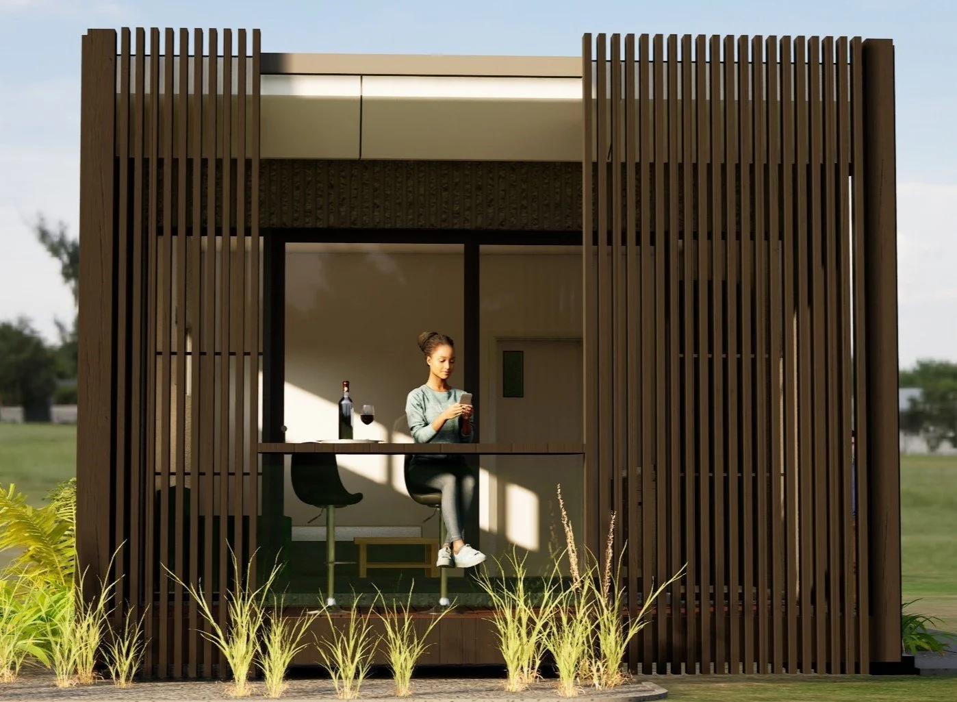 A woman sitting at a counter in a modern outdoor structure made of vertical wooden slats, mid north coast modular homes scconstruction.online
