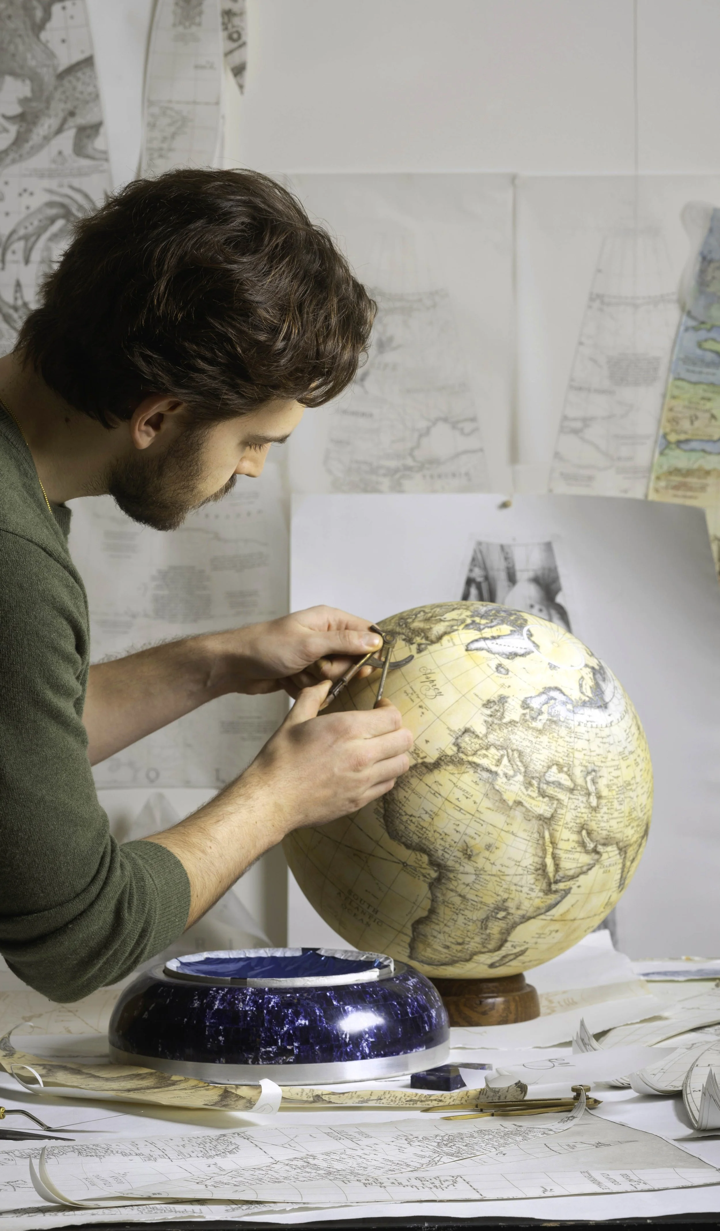 Editorial Fashion Photography from London based filmmaker / photographer Aris Mercury featuring globemaker Leonardo Frigo making the limited edition Asprey globe for Asprey London.
