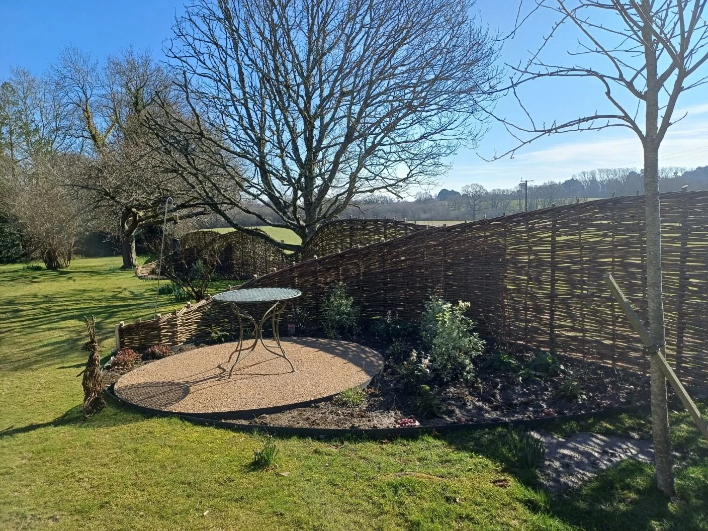 New seating area and planting in the 'fishtail' sections of this 90m insitu fence. Designed by Katy Terry of Good Grounding Garden Design.