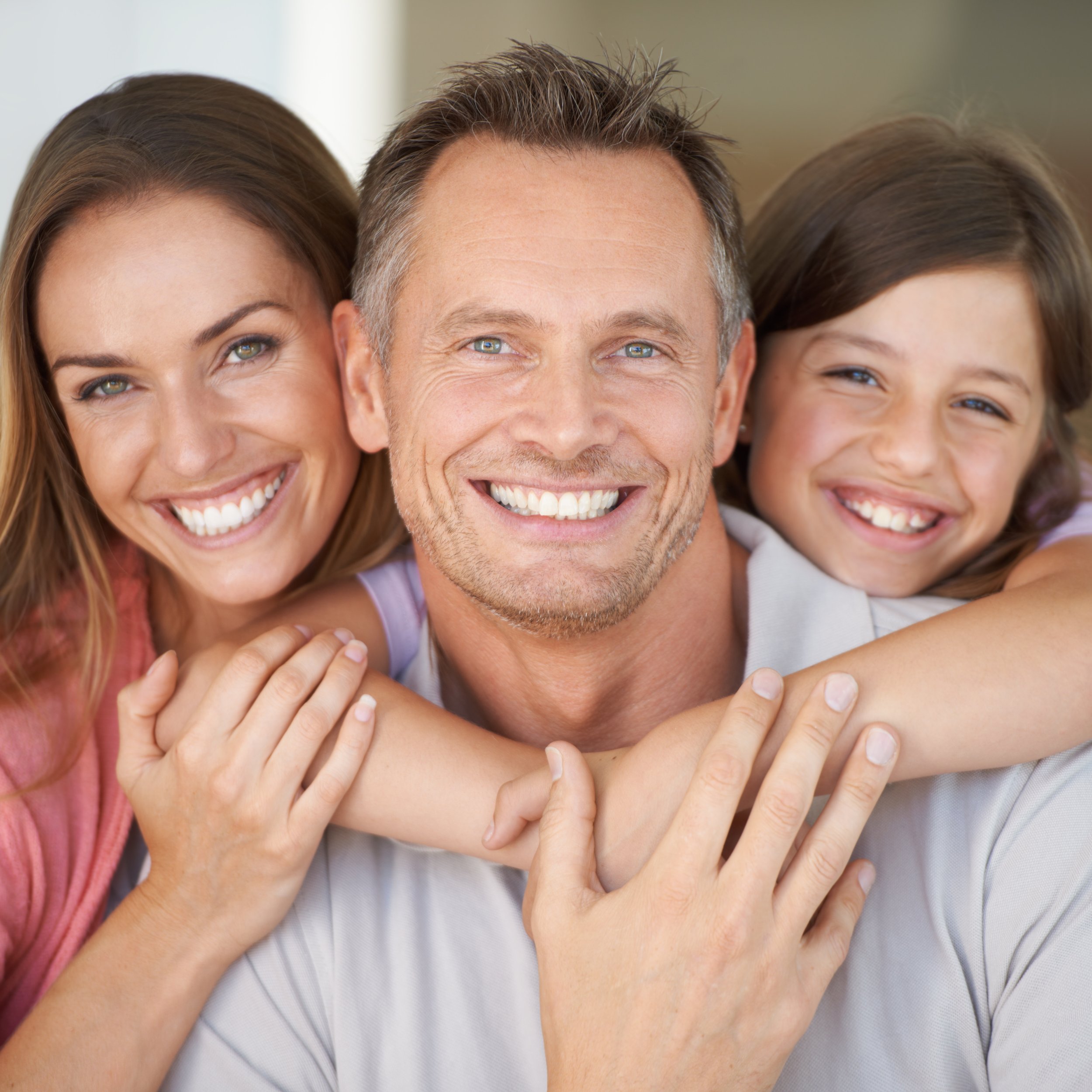 iStock-Wife Husband with Daughter arms wrapped around_497111493.jpg