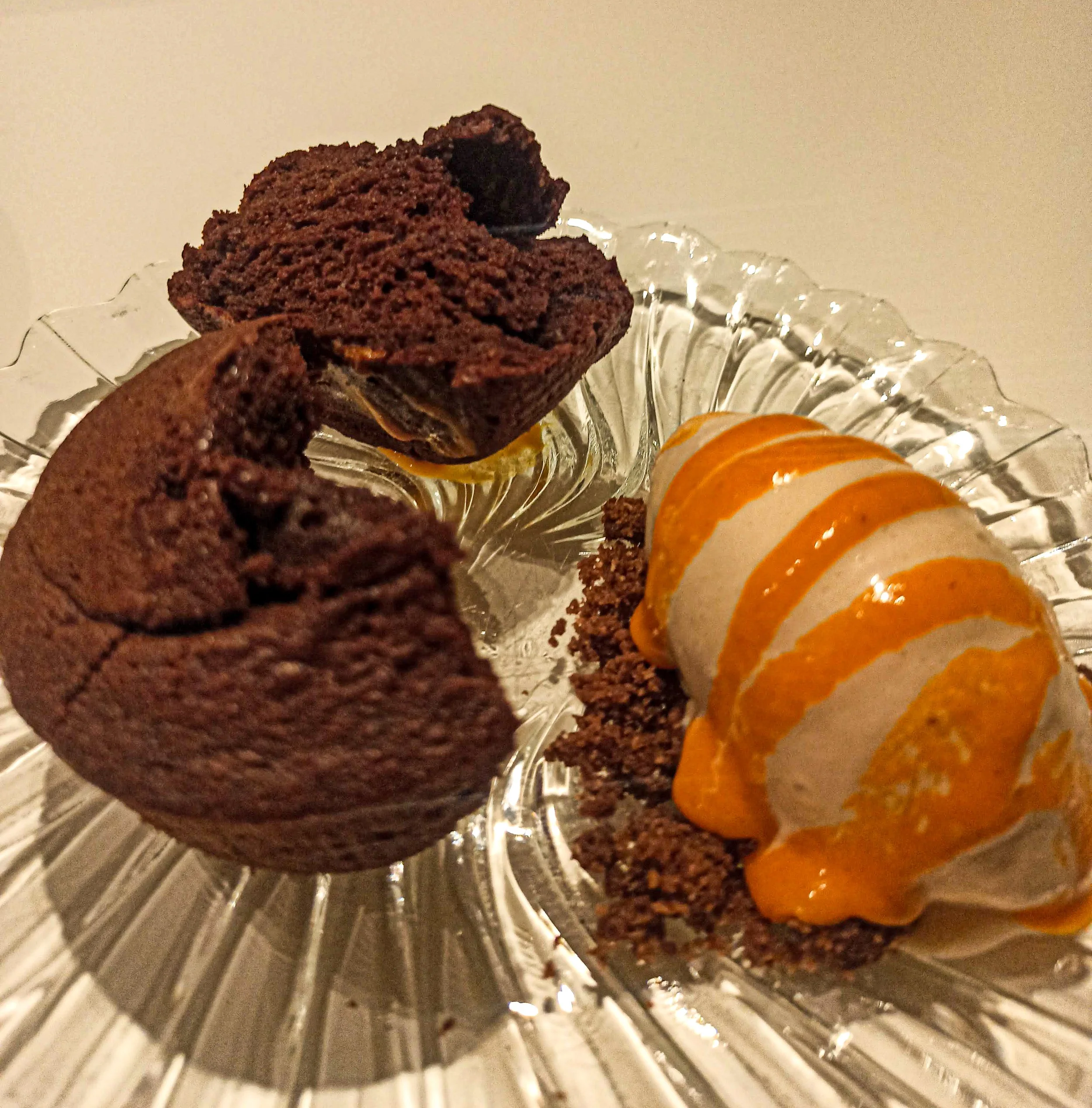 Valhrona dark Chocolate sponge cake served with vanilla icecream and a coulis of sea buckthorn berries