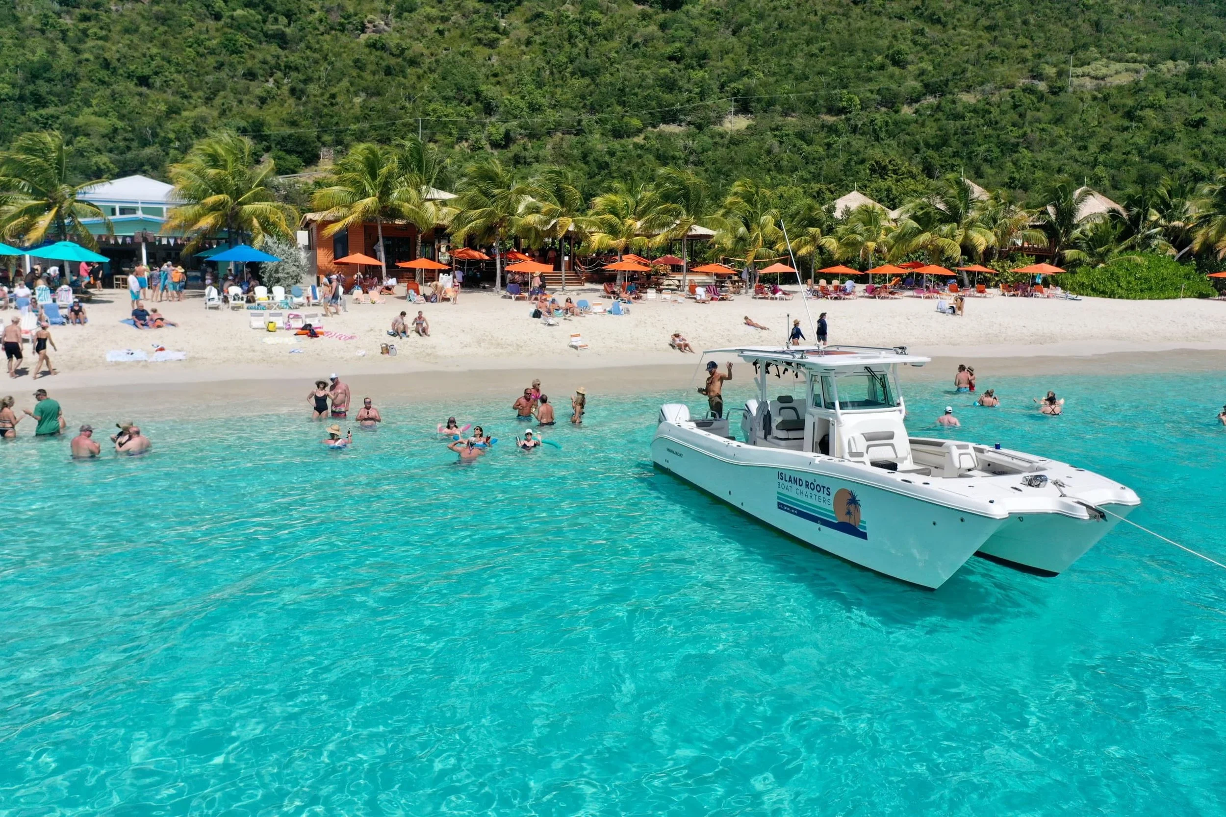 Photo: Island Roots Charters anchored in front of Hendo’s Hideout, White Bay  / Credit: Island Roots Charters