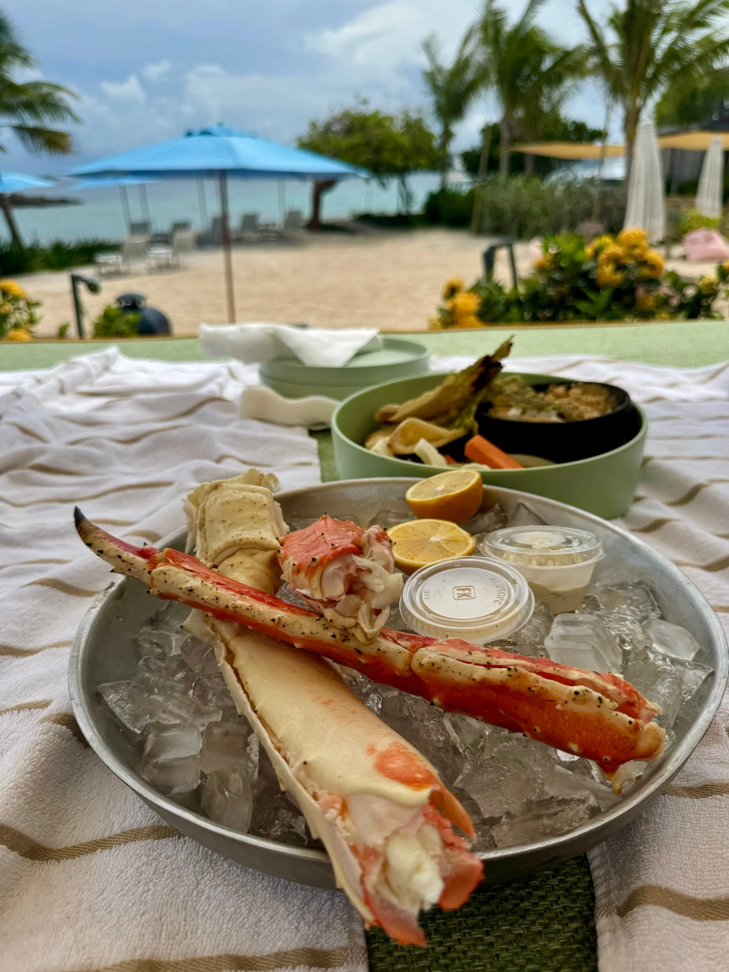Photo: King Crab legs served beachside. / Image credit: Island Roots Charters
