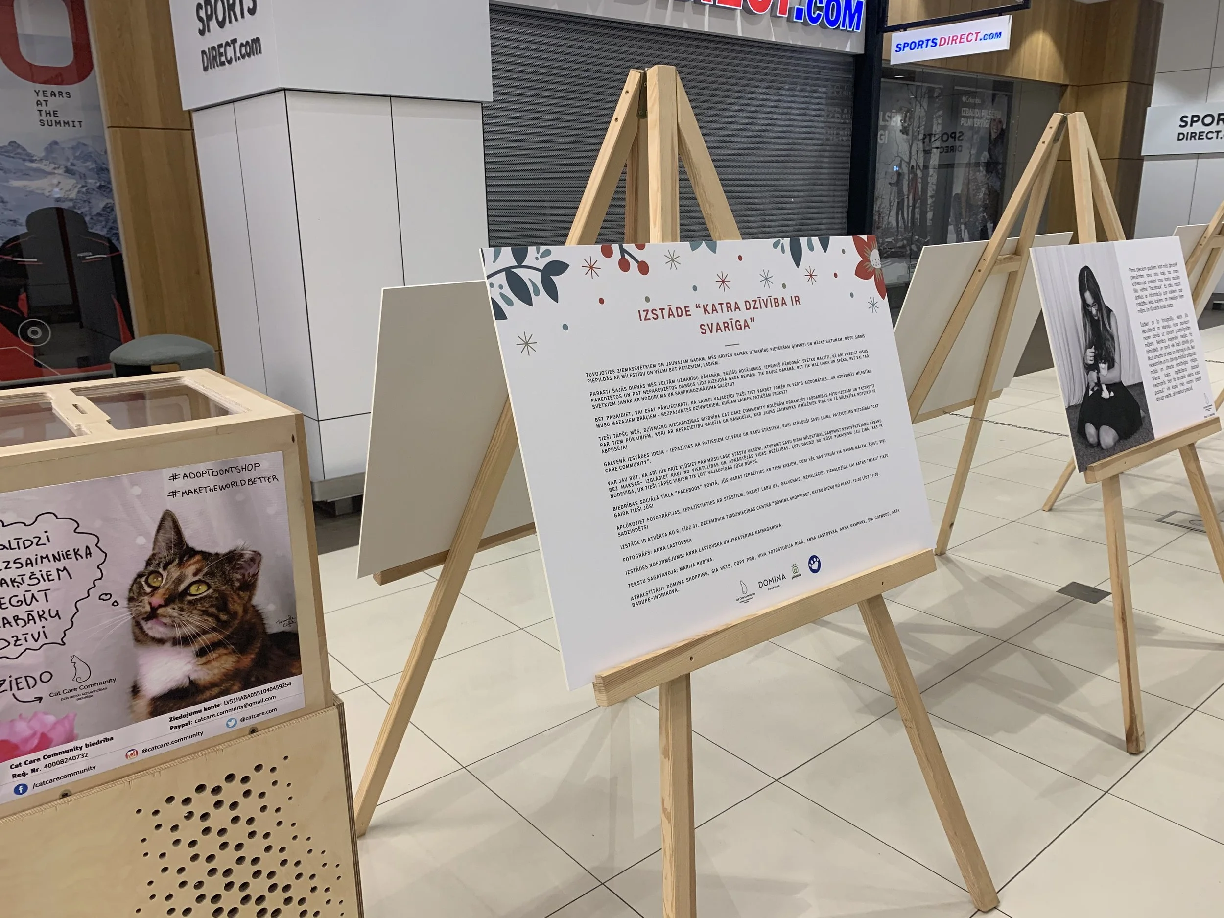 Information board about cat photo exhibition in mall