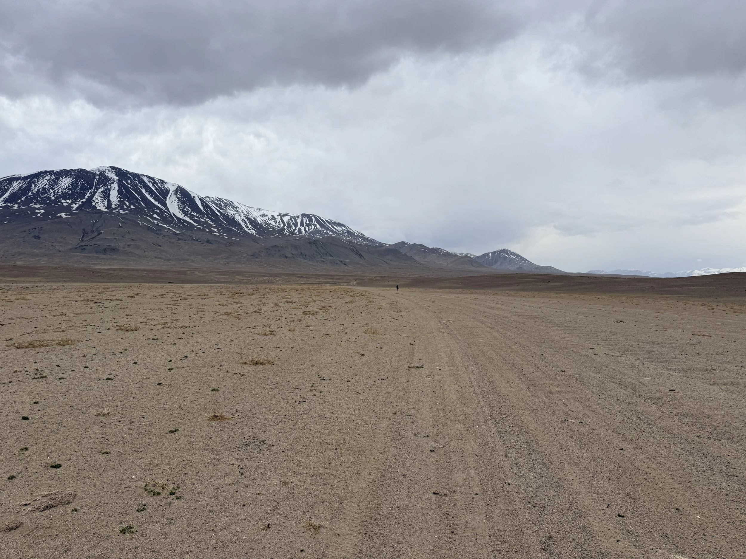 Seeminly endless dirt path on my way to the Chinese border through Tajikistan, 2025
