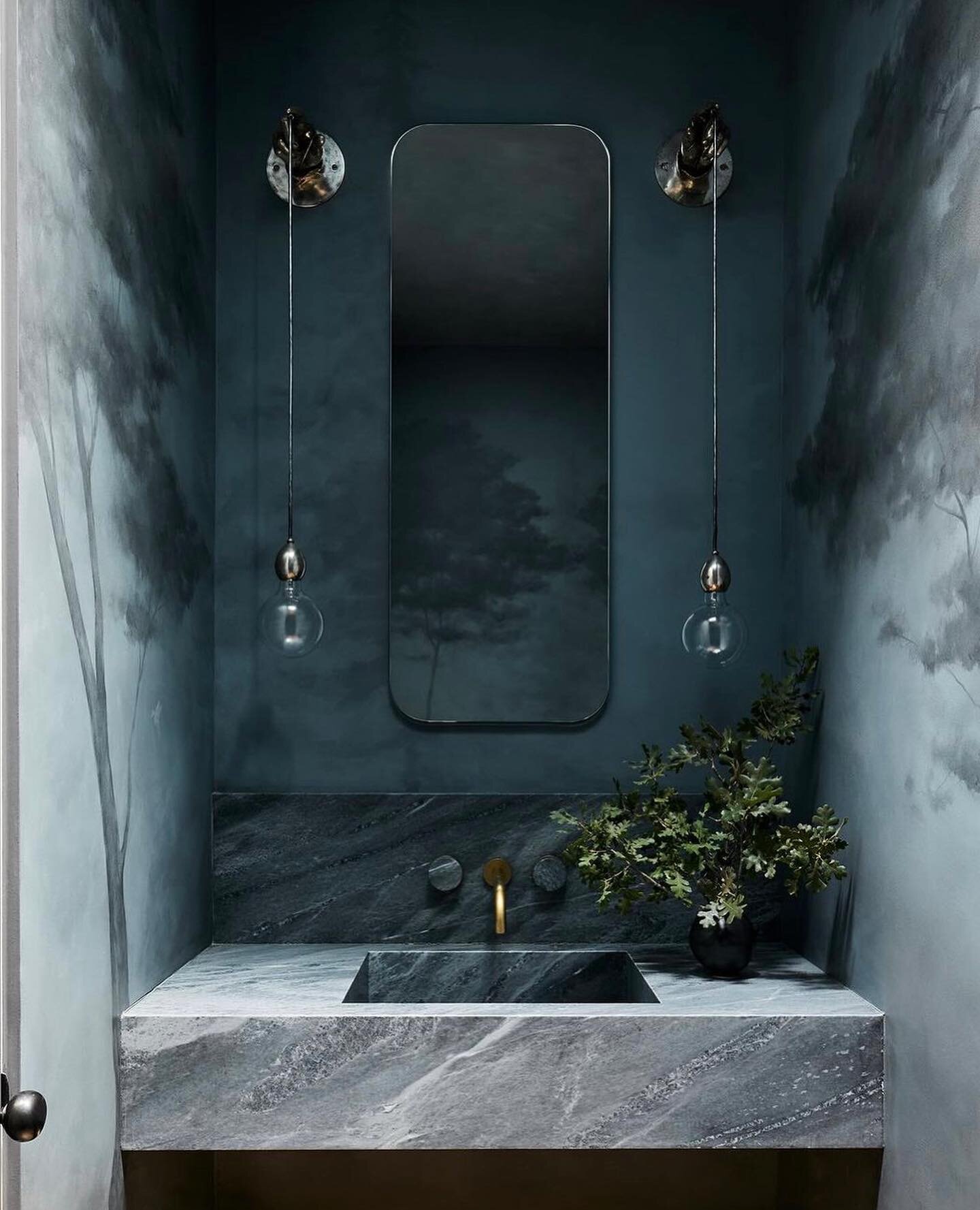 Taking inspiration from @lindsaygerberinteriors moody powder bath design. Enveloped in a dreamy forest mural by @caroline_lizarraga and contrasted with subtle accents of brass. 

Photography: @nicole_franzen 
Builder: @trainorbuilders 
.
.
.
.
.
.
.
