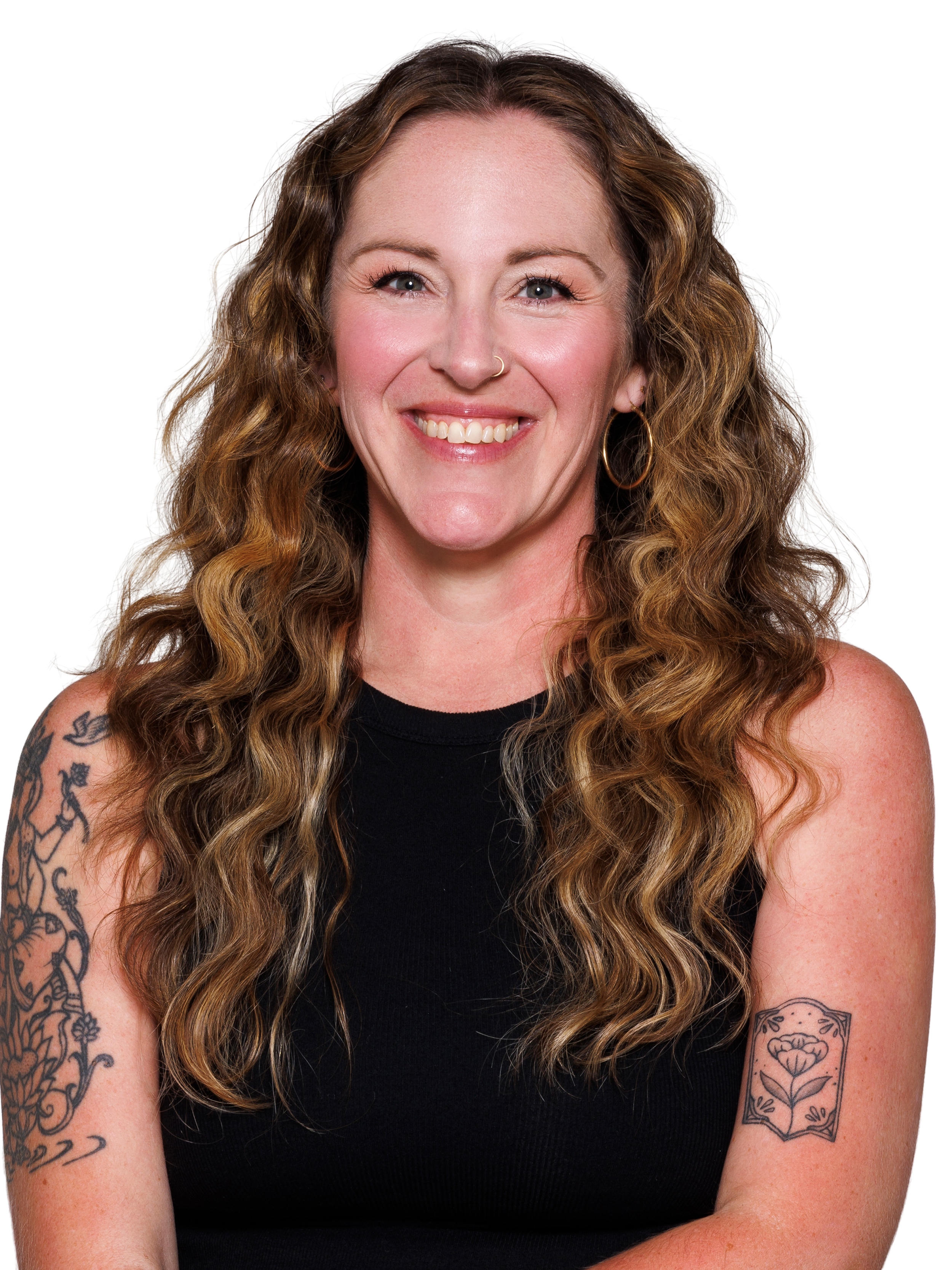 woman with curly brown hair smiling