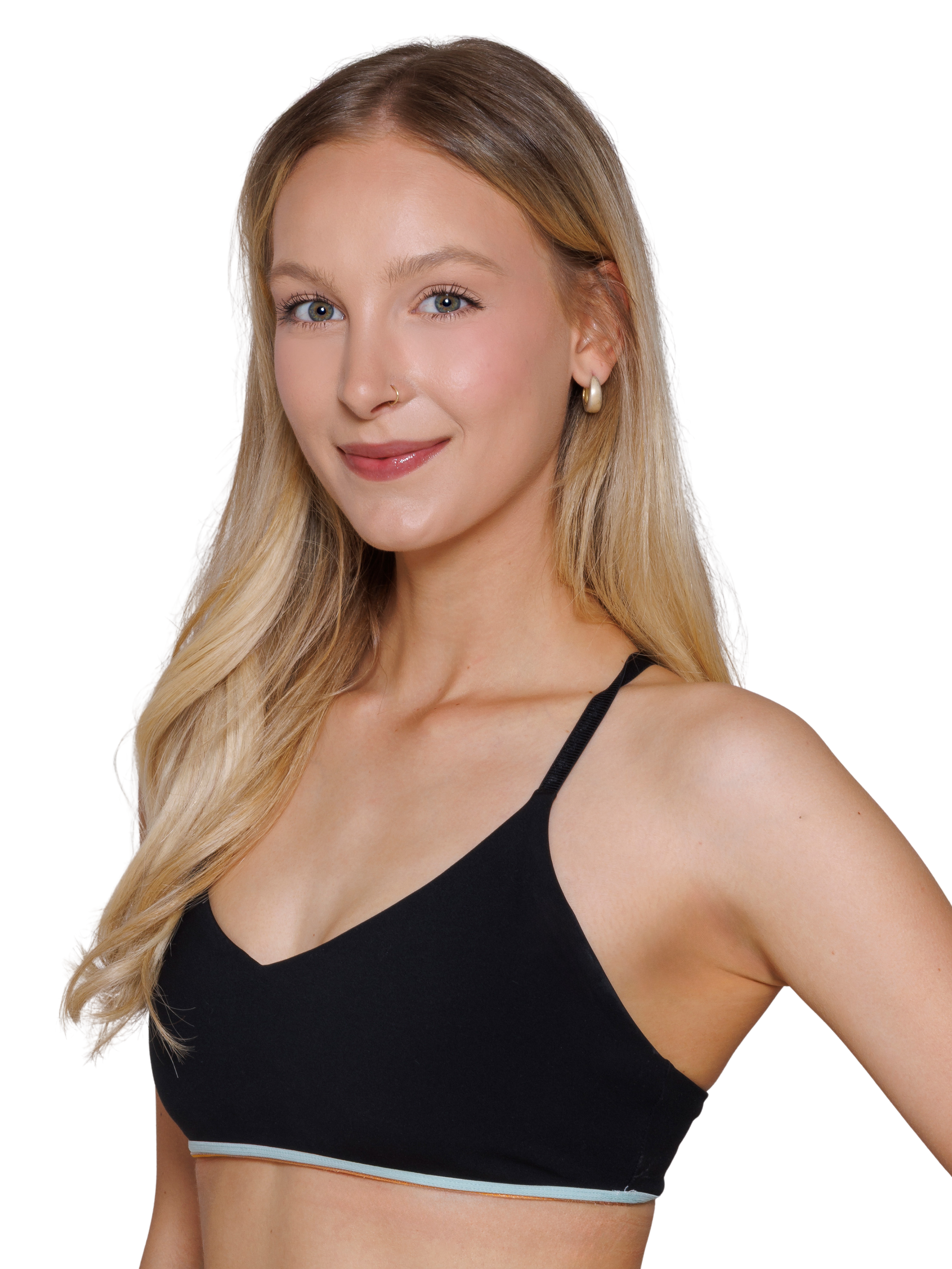 A young woman with shoulder-length blonde hair, wearing a black tank top, smiling with a white background.