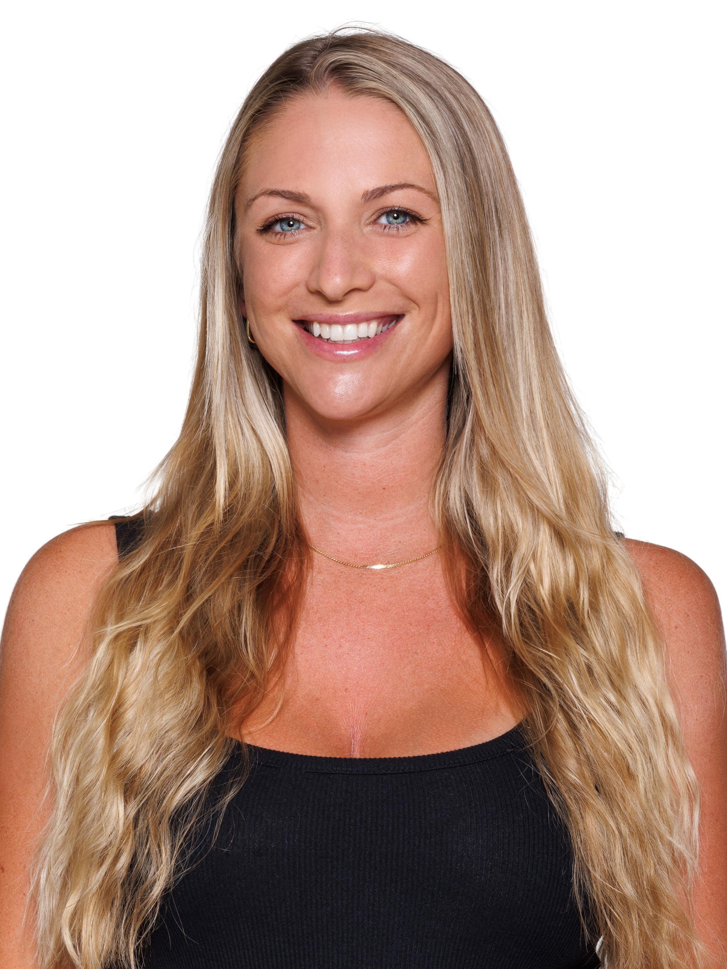 Smiling woman with long blonde hair in athletic wear, standing against a white background.