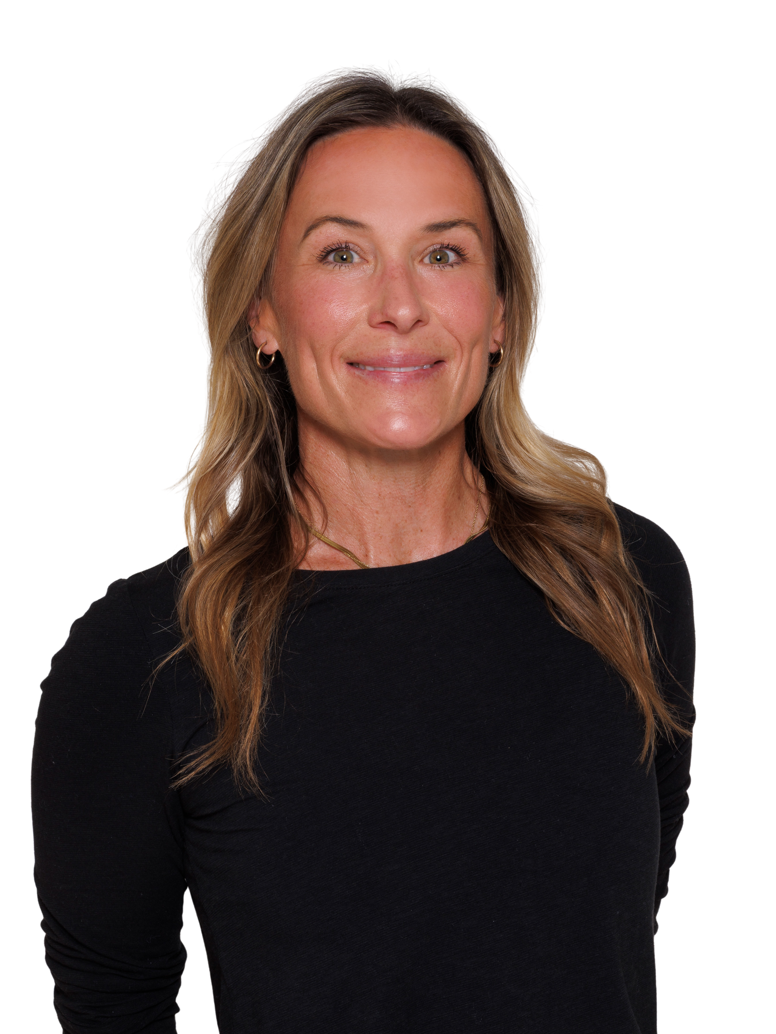 A woman with wavy blonde hair smiling, wearing a black long-sleeve top, against a plain white background.