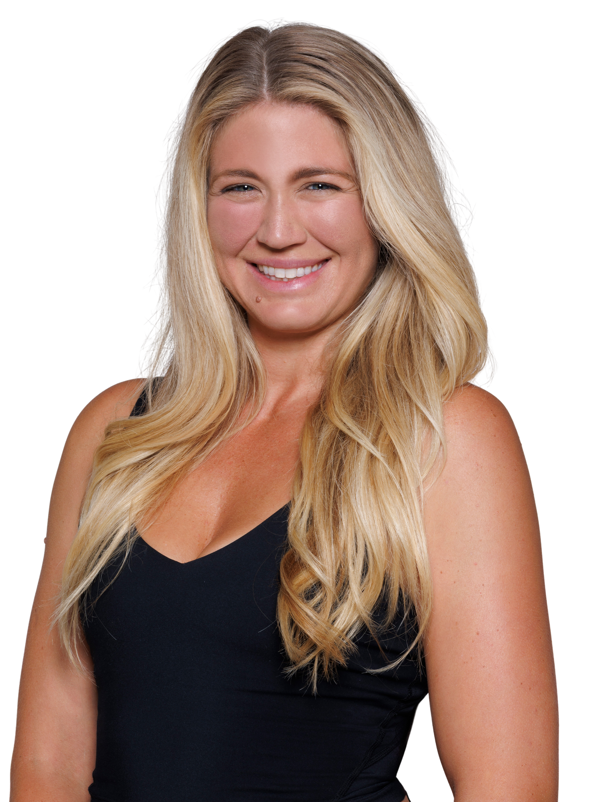 A woman with shoulder-length wavy blonde hair smiling and wearing a black spaghetti strap top.