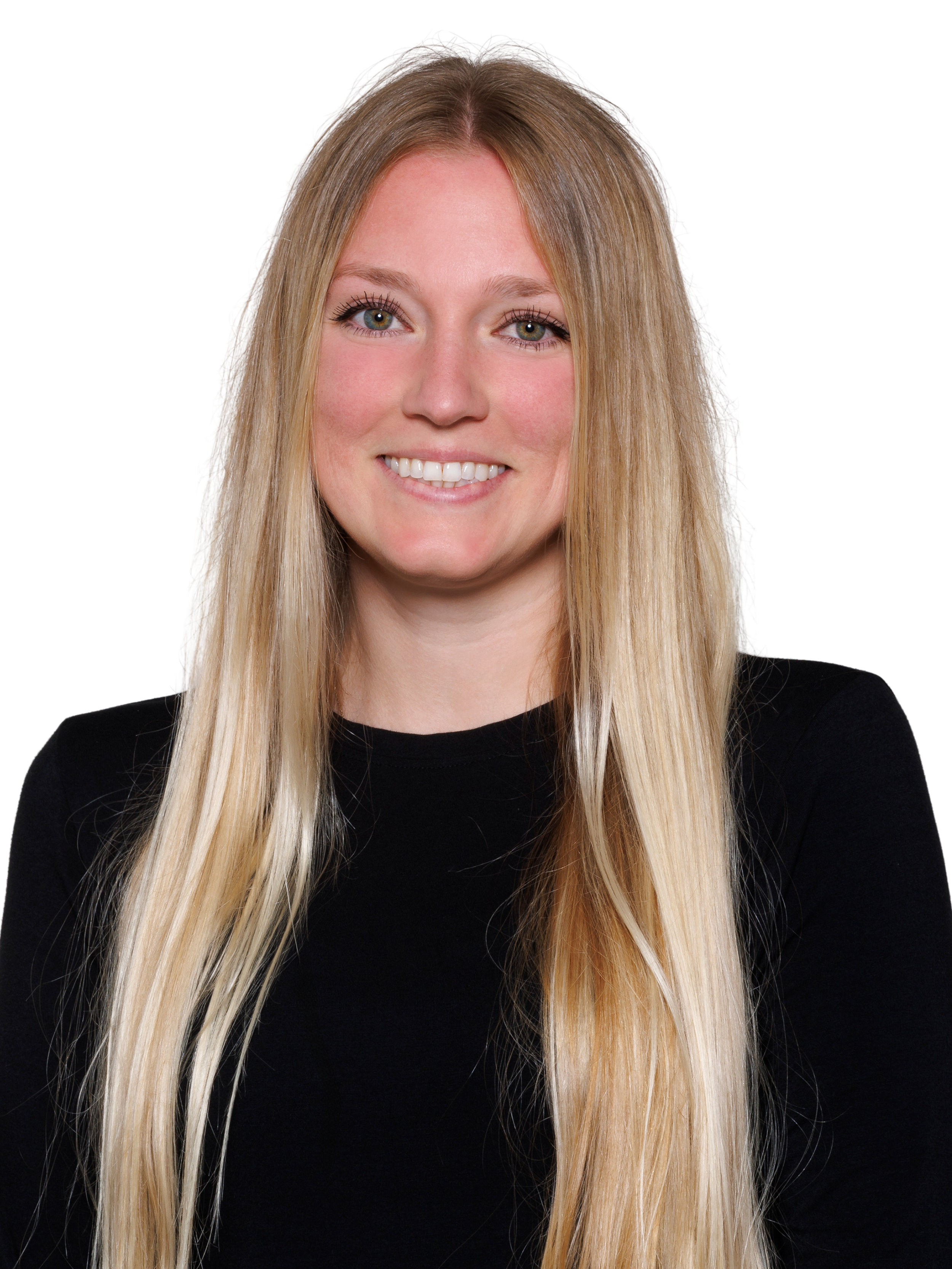 Portrait of a young woman with long blonde hair, wearing a black sleeveless top and layered gold necklaces, smiling at the camera.