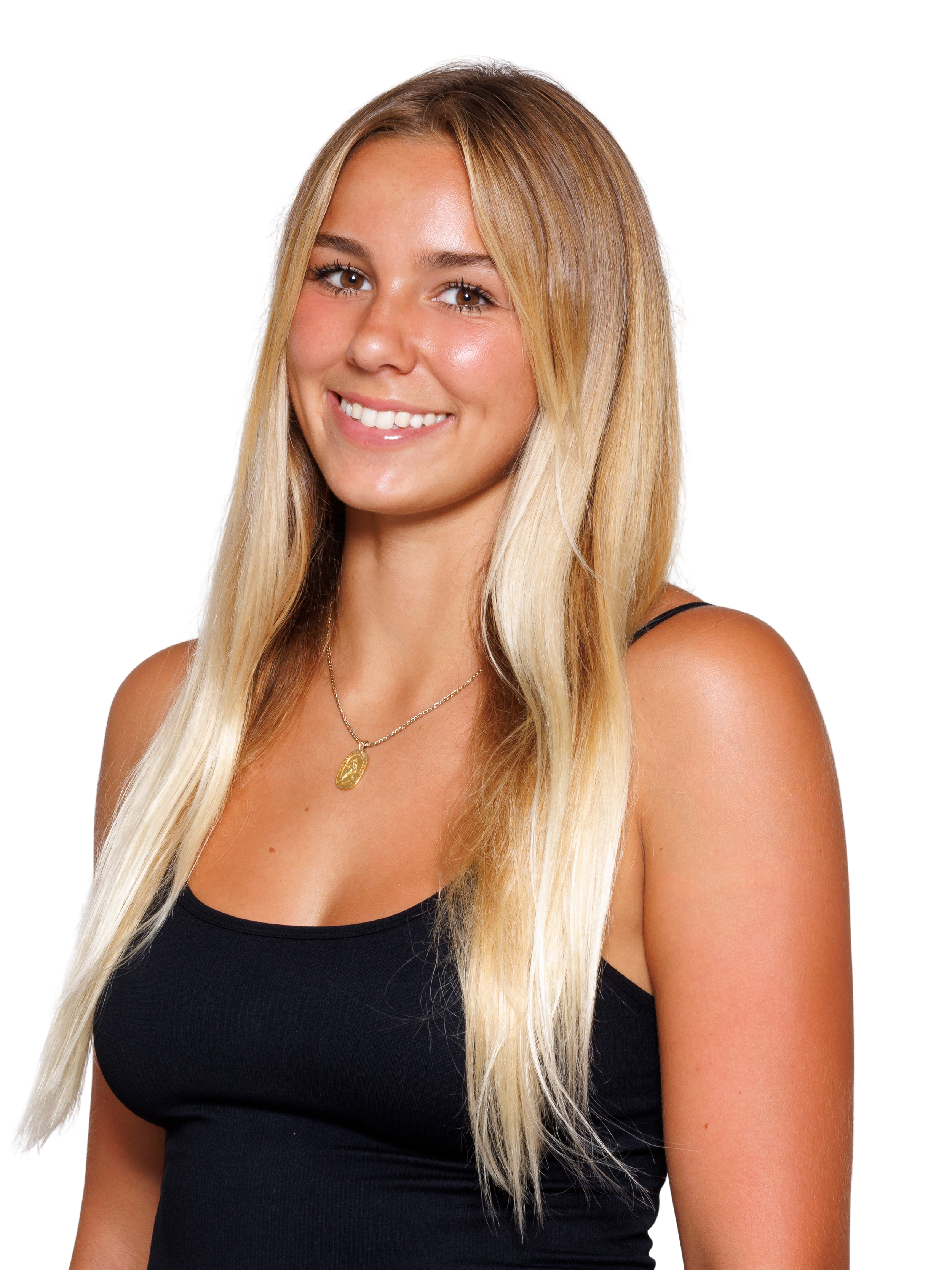 A young woman with light blonde long hair smiling at the camera, wearing a black tank top and a pendant necklace against a white background