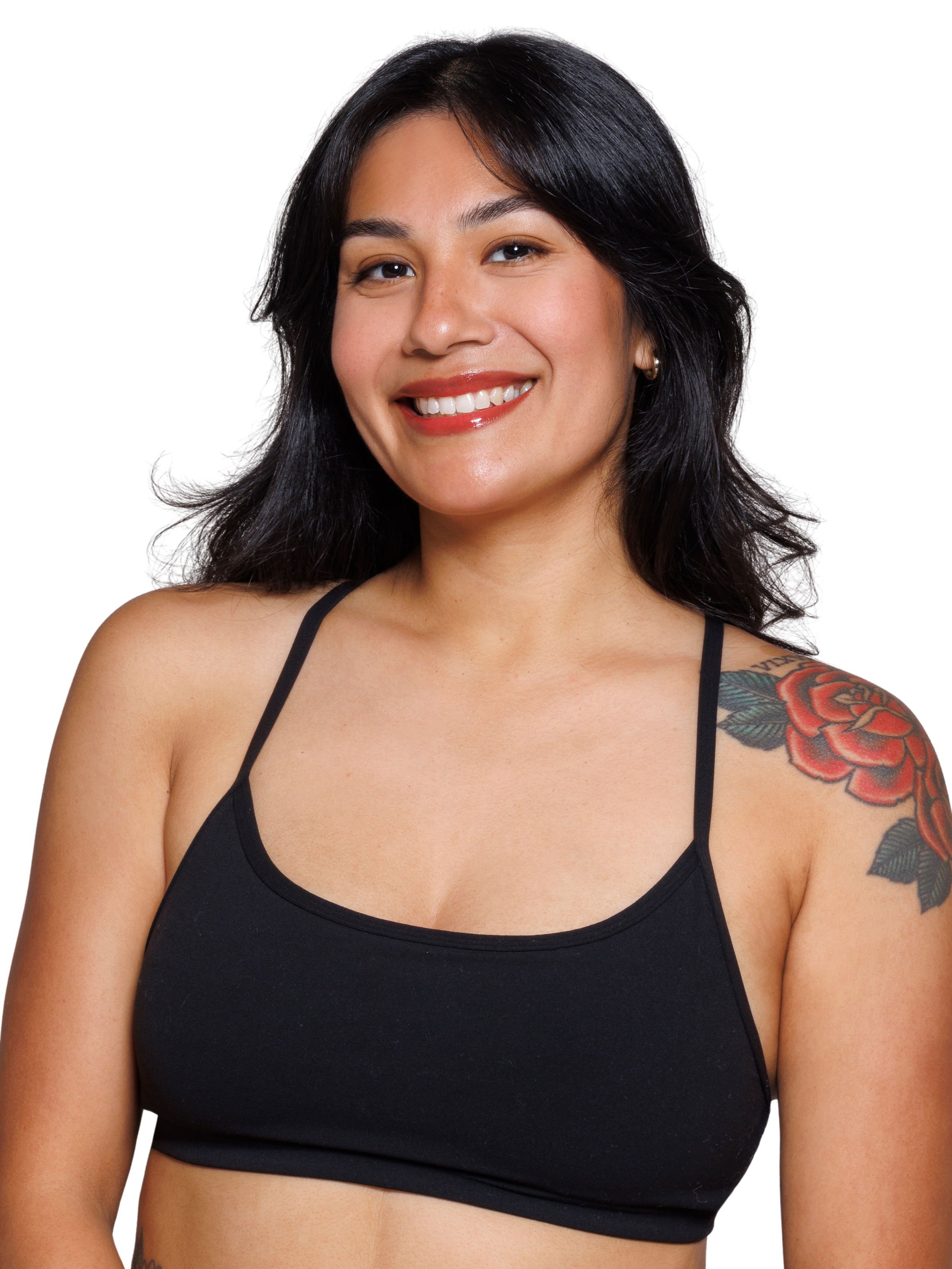 A young woman smiling, wearing a black long-sleeve crop top and a smartwatch, standing against a background with black and blue horizontal stripes.