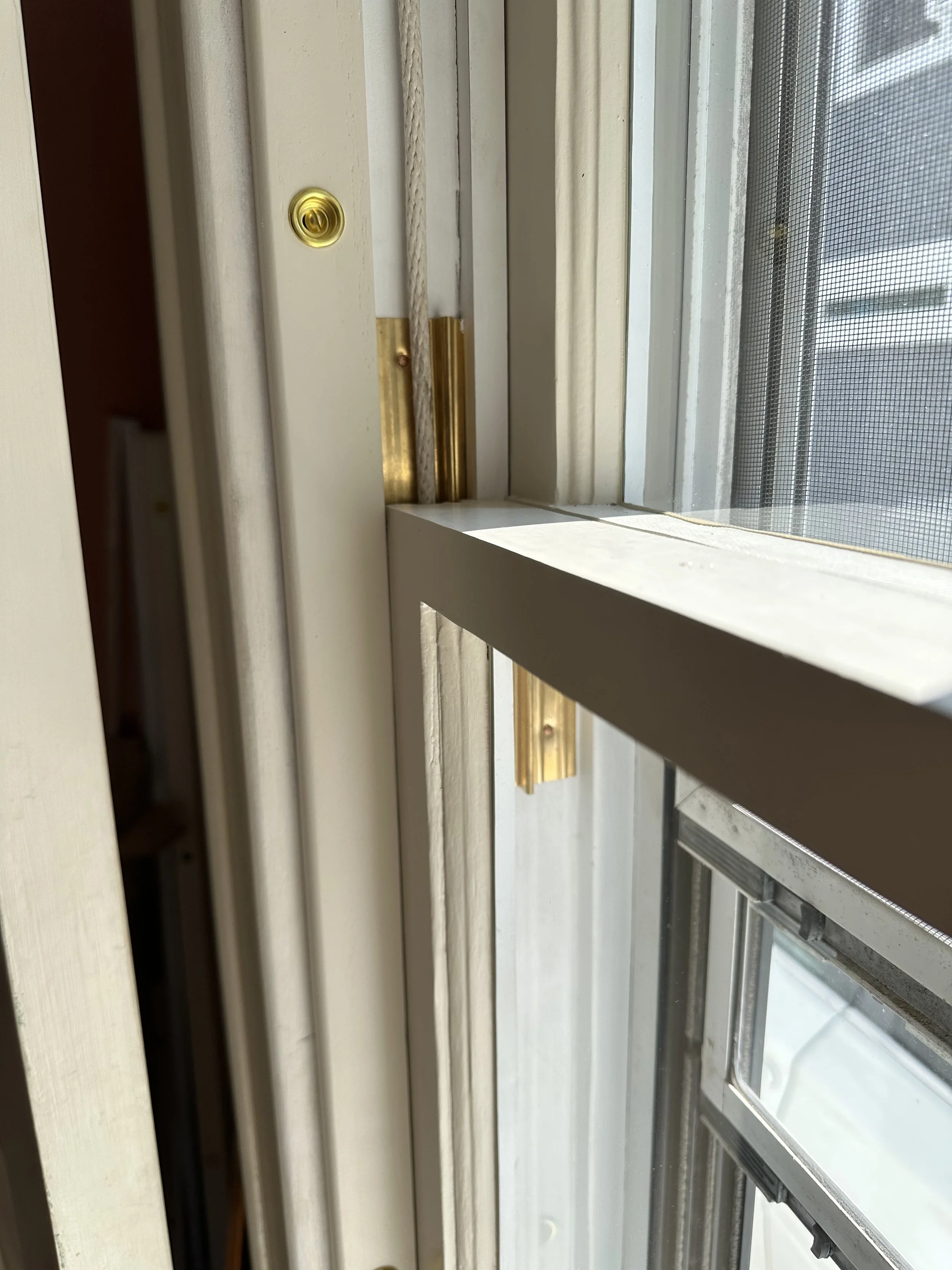 1926 Craftsman Bungalow. Window restoration & bronze weatherstripping detail. Shorewood. 