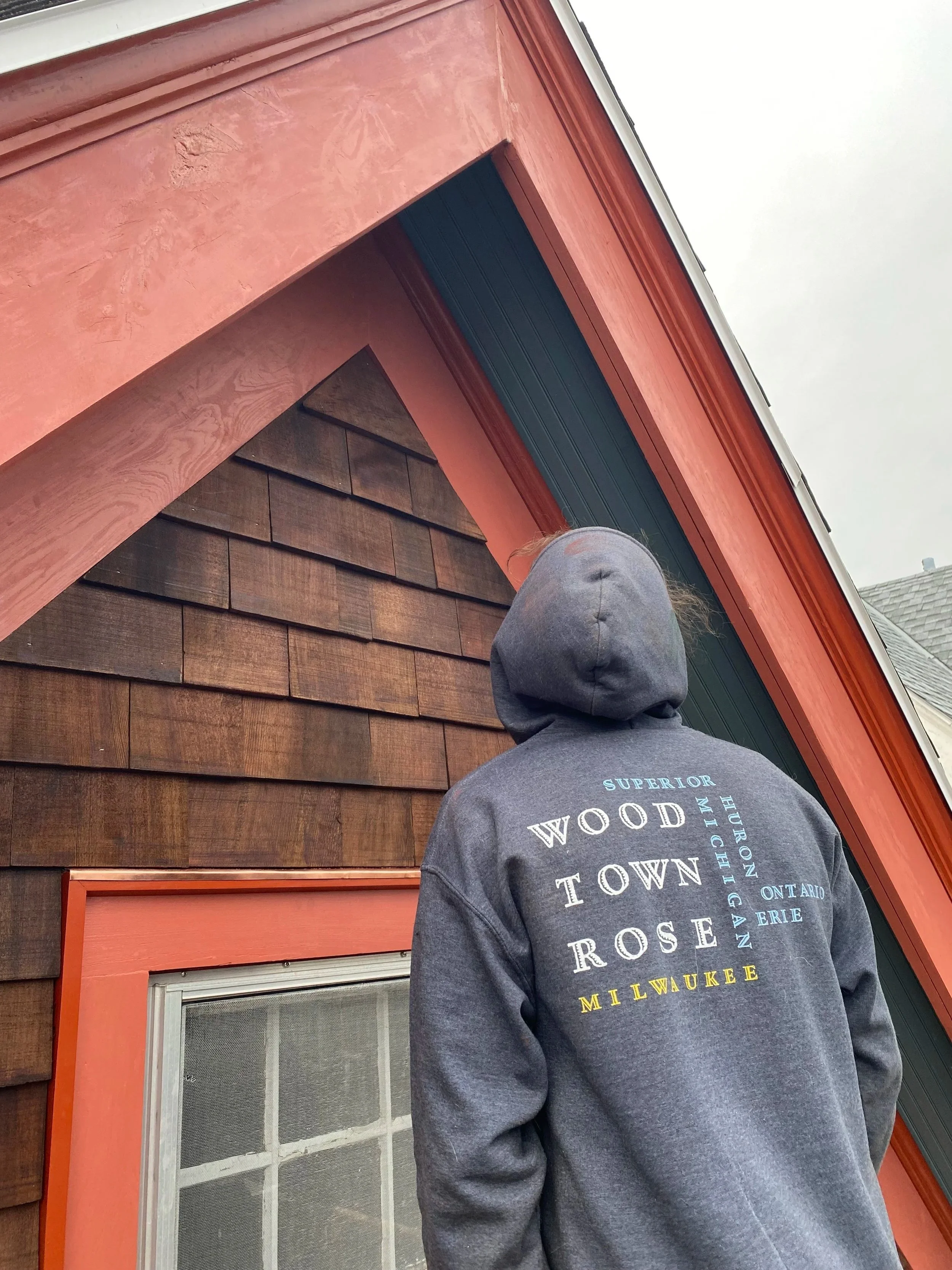 Checking for any missing details on a fully restored Victorian gable. Pine tar shingles.  Linseed oil paint. 