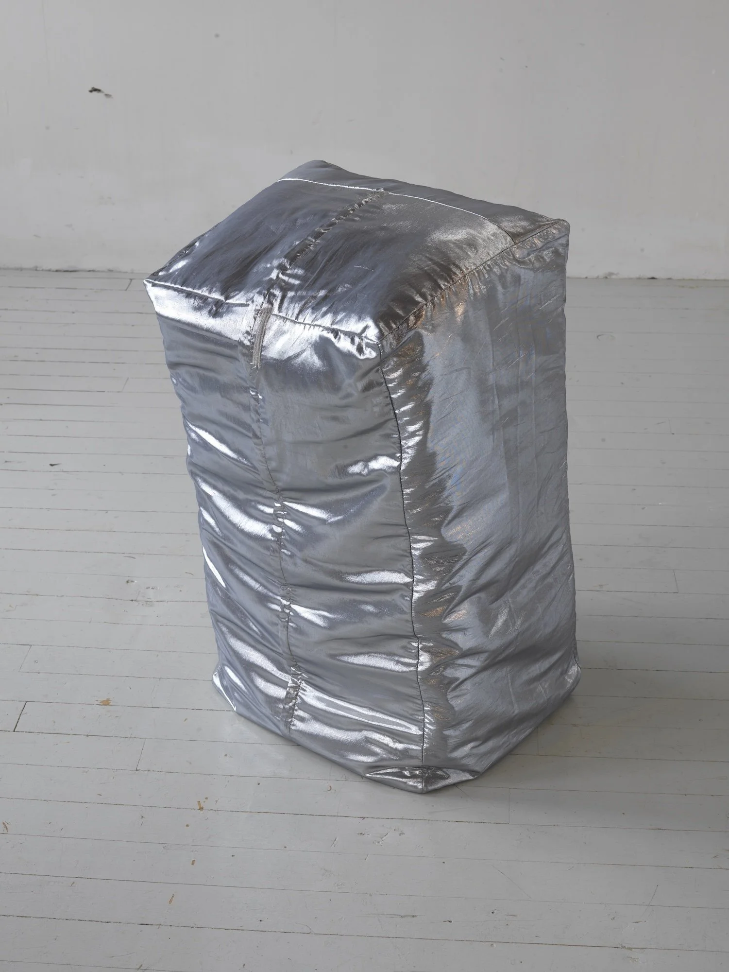 Untitled (Duck Goes Out), 2007, silk silver lame, bale of sweet timothy and alfalfa, 35 x 20 x 15 inches