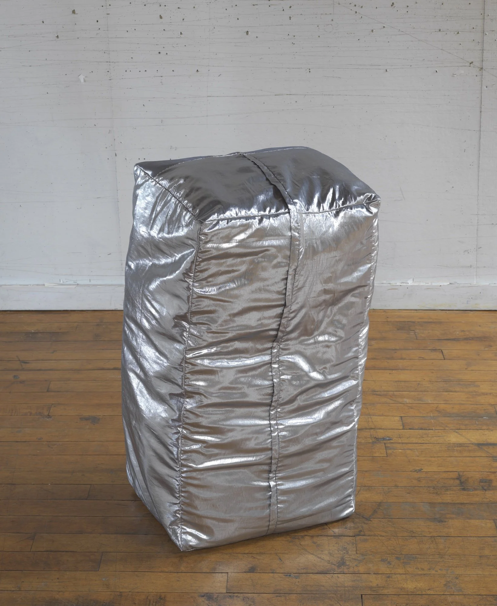Untitled (Duck Goes Out), 2007, silk silver lame, bale of sweet timothy and alfalfa, 35 x 20 x 15 inches, other view