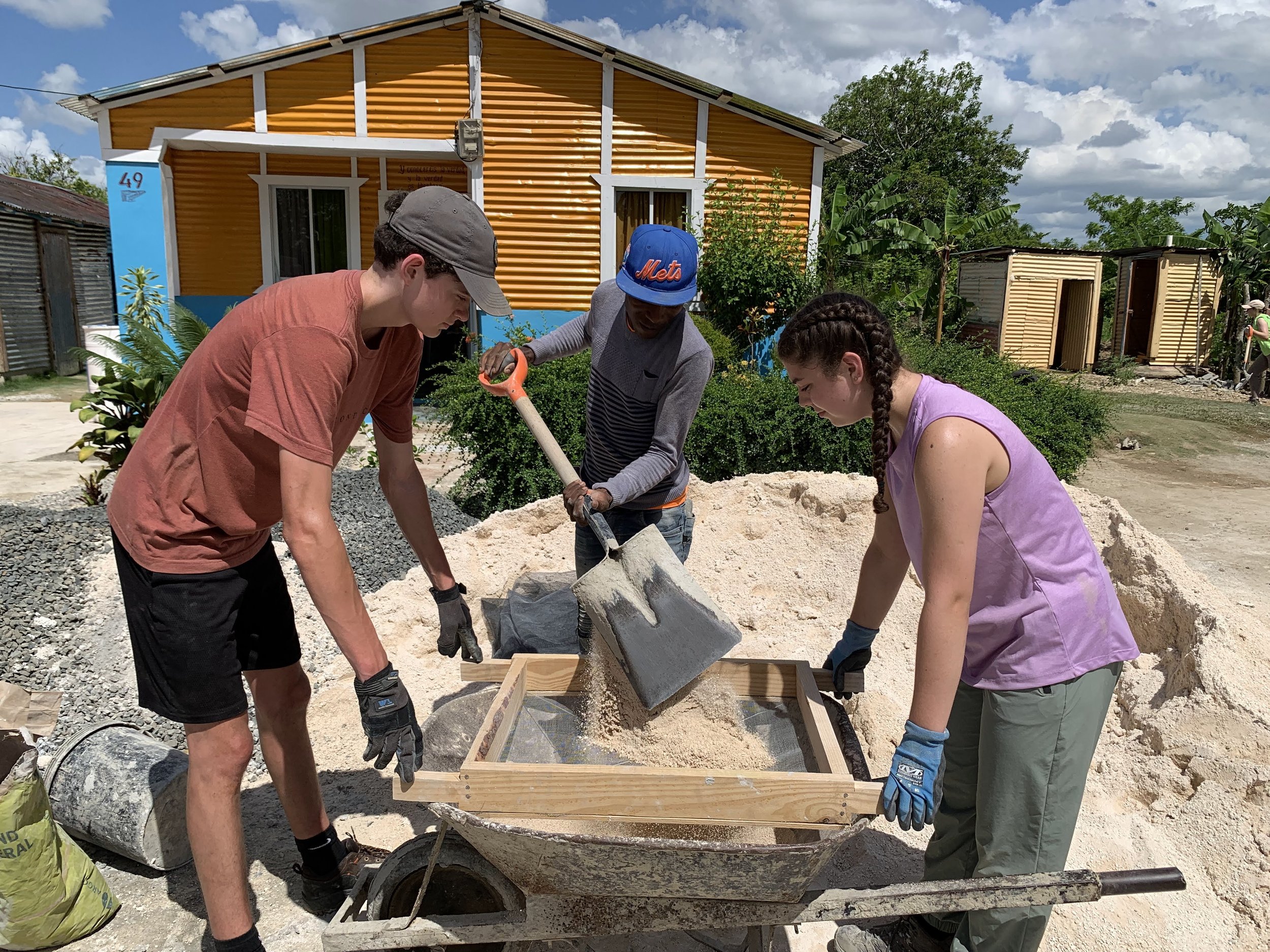 students helping with a service project during a travel program in the Dominican Republic.jpg