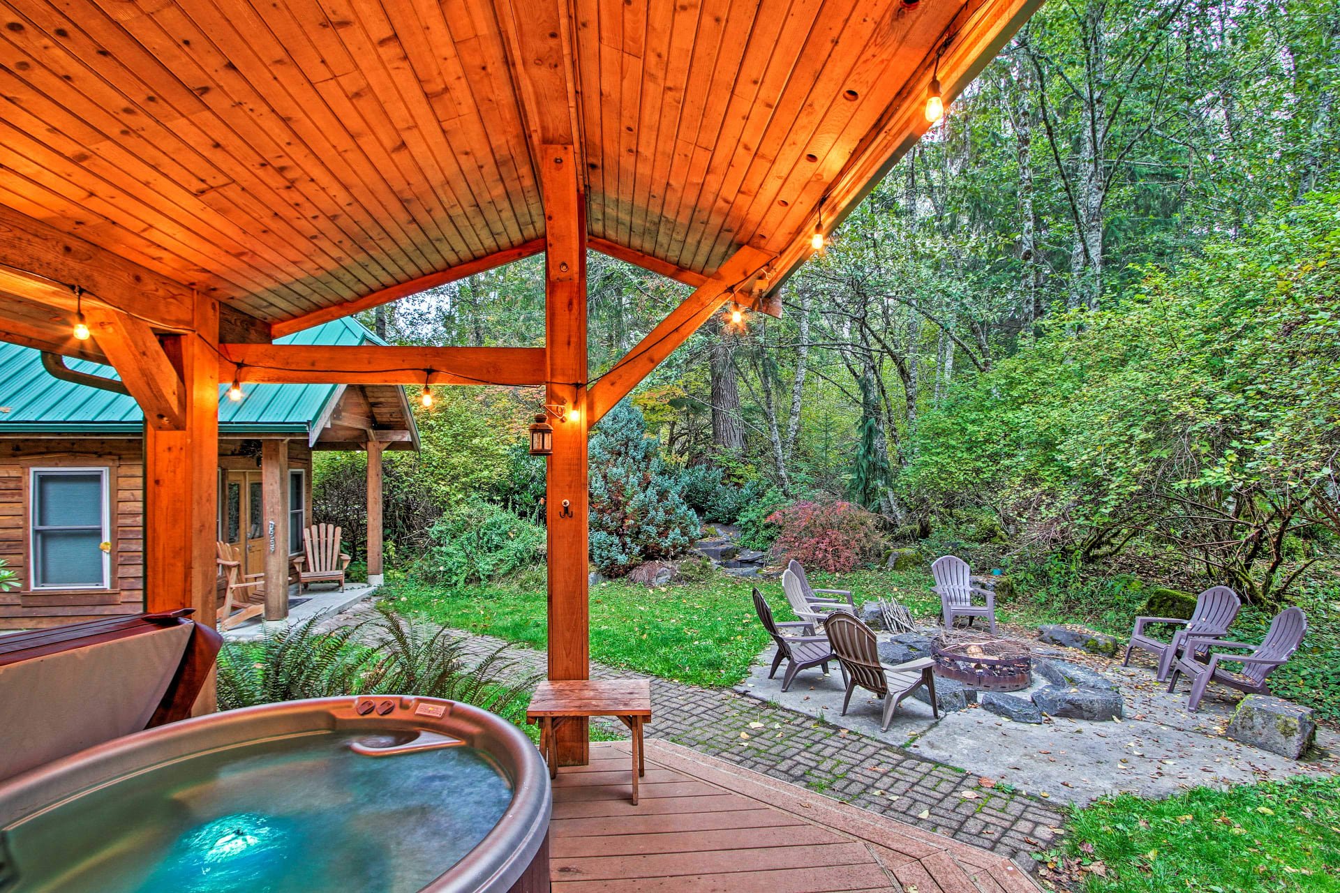 The backyard is perfect for entertaining whether by fireside, in the hot tub, or on the large wraparound deck.