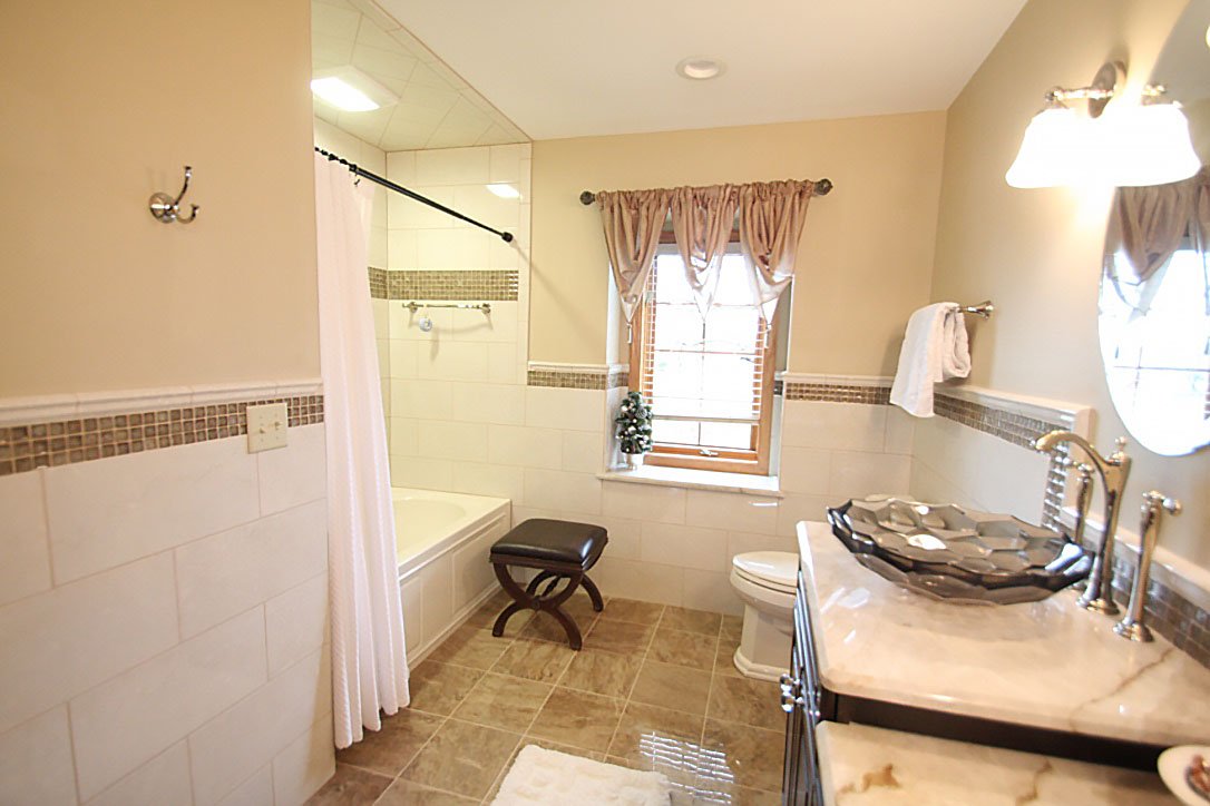 Marble countertops vessel sinks in a bathroom