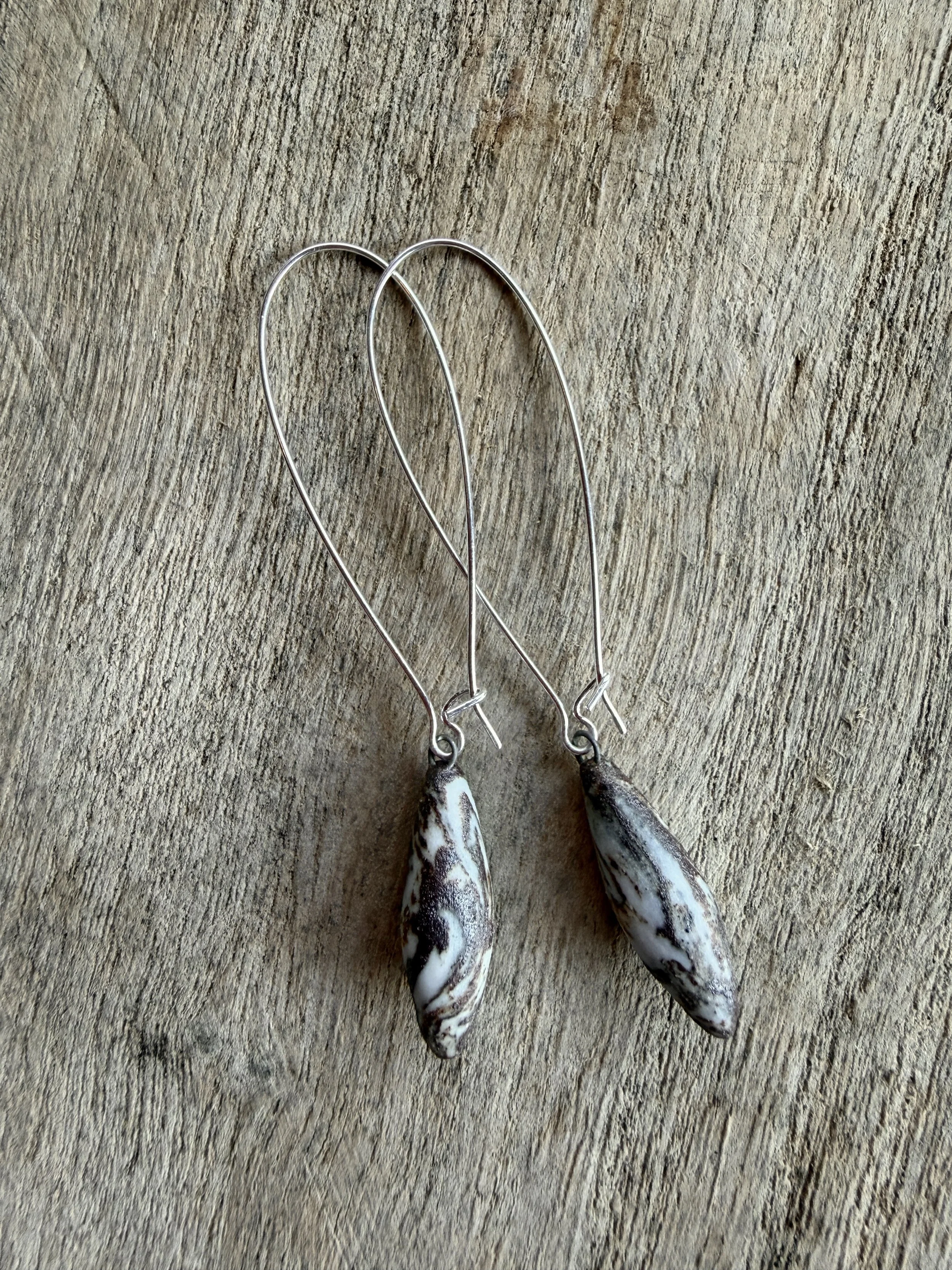 marbled ceramic earrings (spindle-shaped pendant, long drop hooped ear wires)